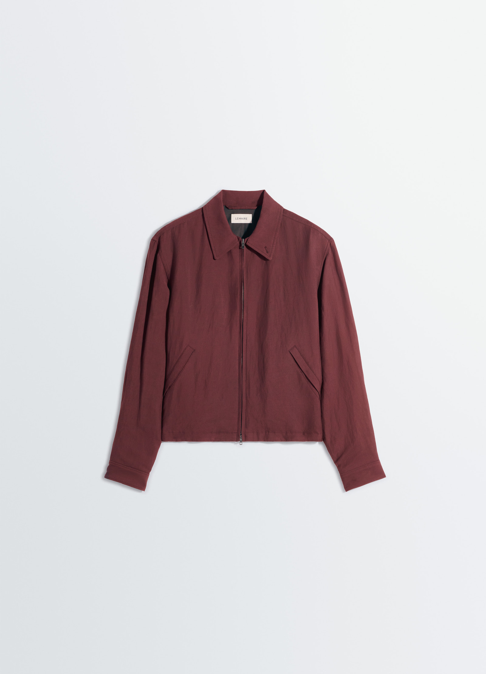 Short blouson in viscose linen gabardine, product shot, top-down view zip closure, angled pockets