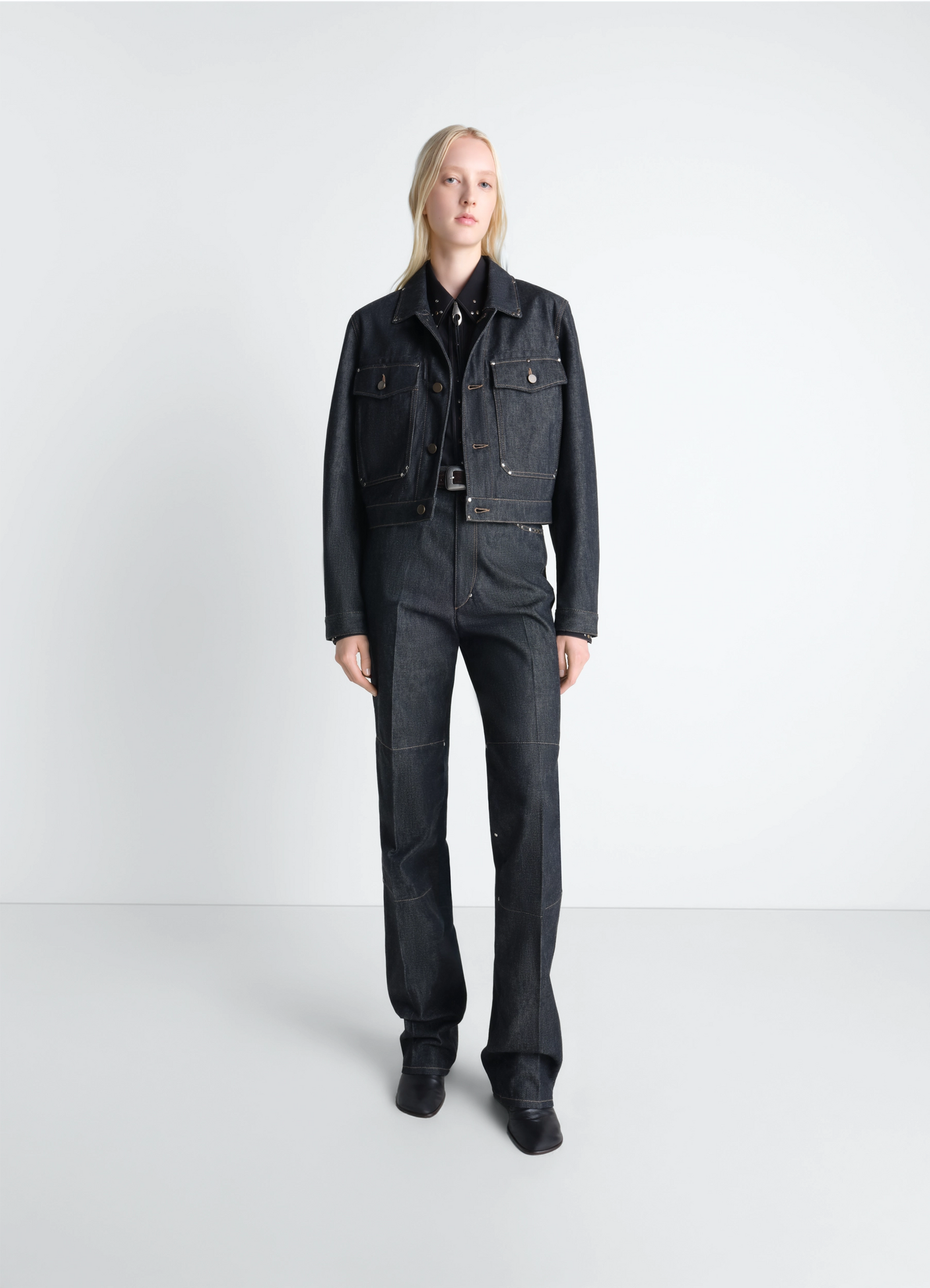 Cropped blouson with studs in slate-colored denim, model shot, full-body front view buttoned long sleeves