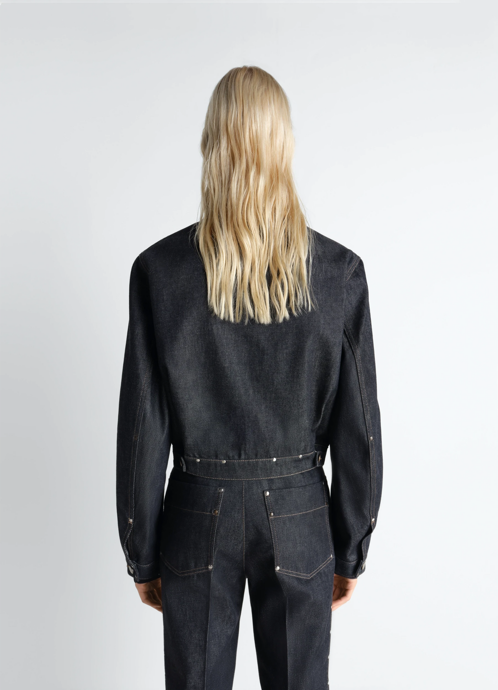 Cropped blouson with studs in slate-colored denim, model shot, back view structured waist fit