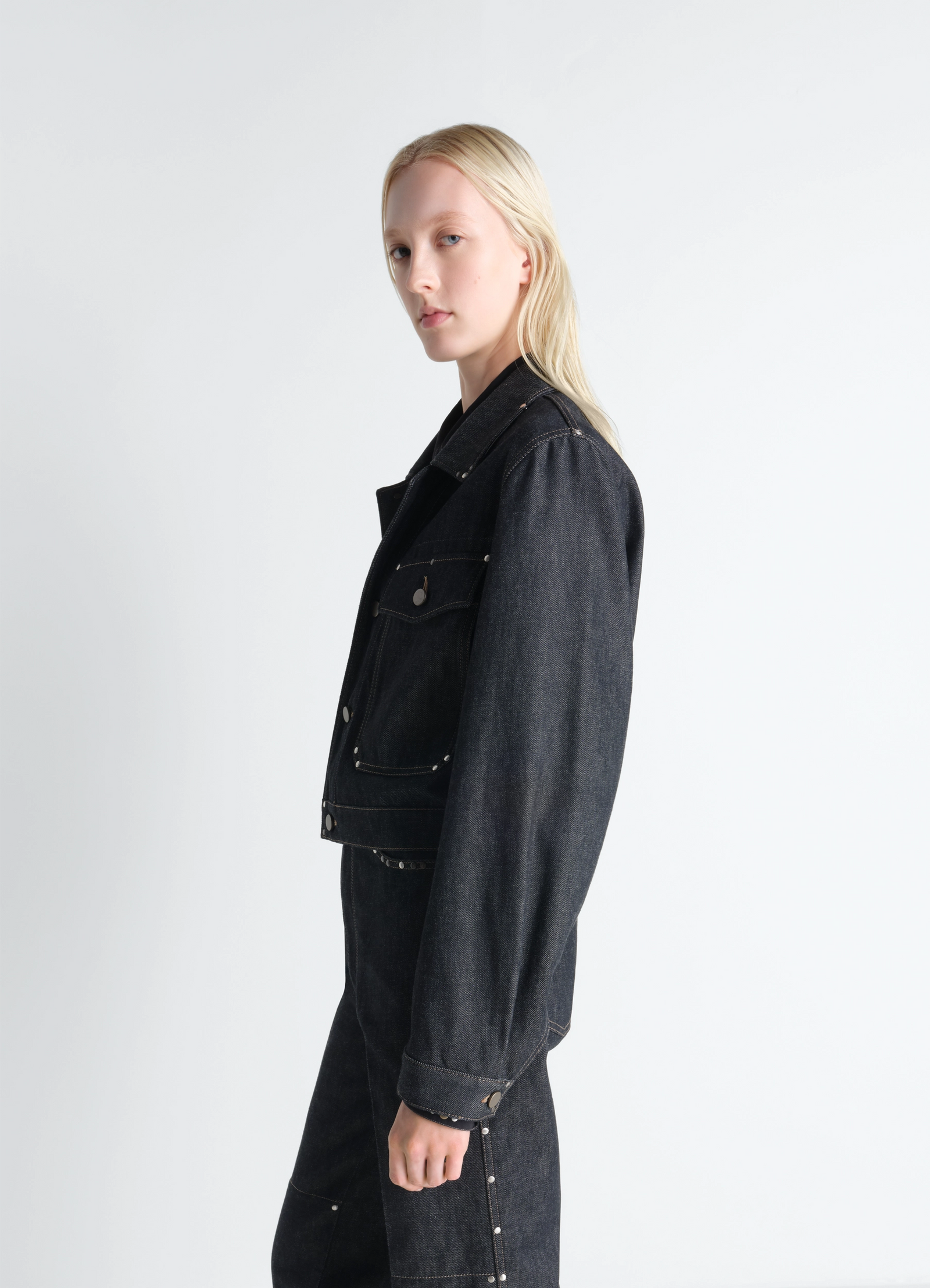 Cropped blouson with studs in slate-colored denim, model shot, side view structured shoulder fit