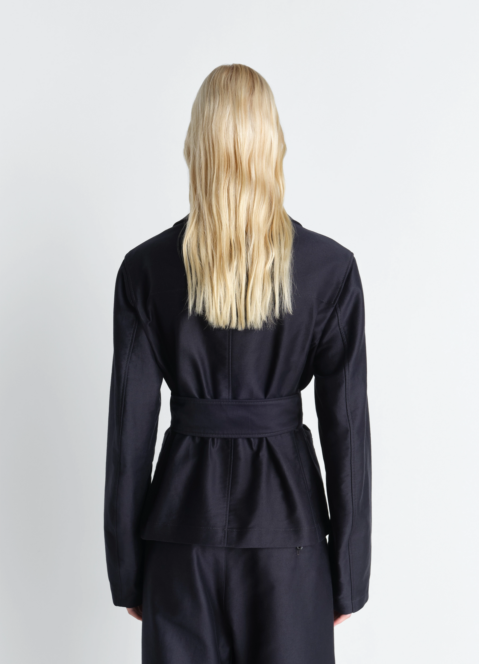 Belted utility jacket in cotton satin, model shot, back view peplum hem design