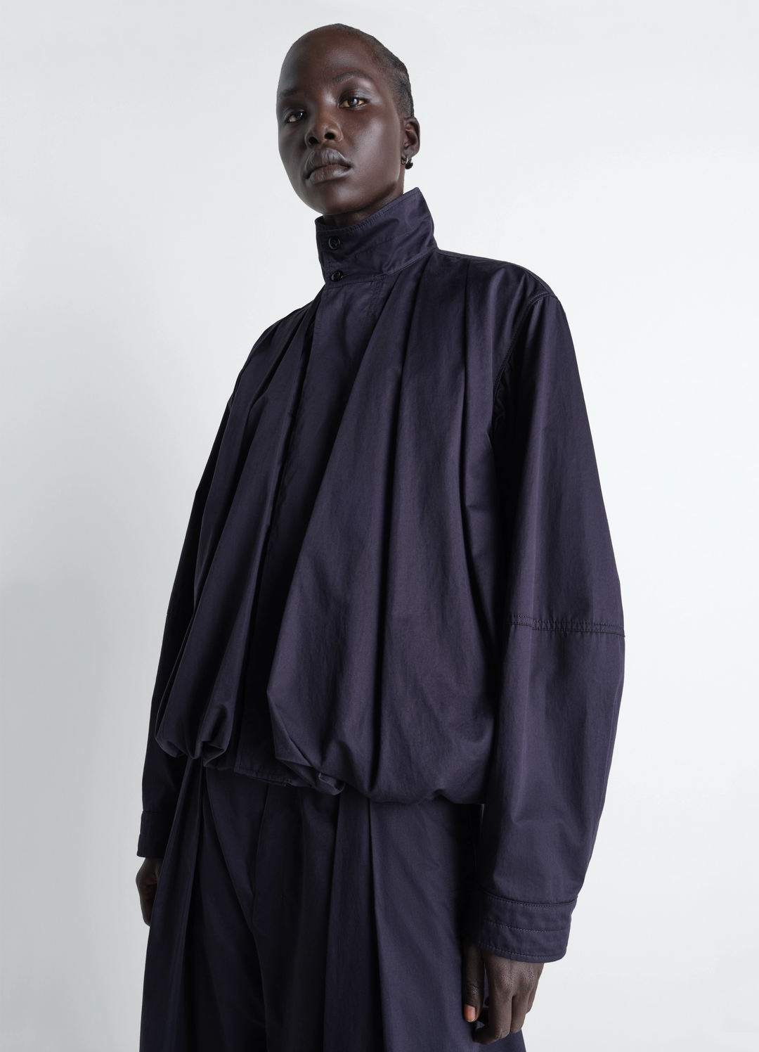 Lemaire Soft Pleated Blouson in Cotton Satin, model shot, Front side view Pleated balloon jacket