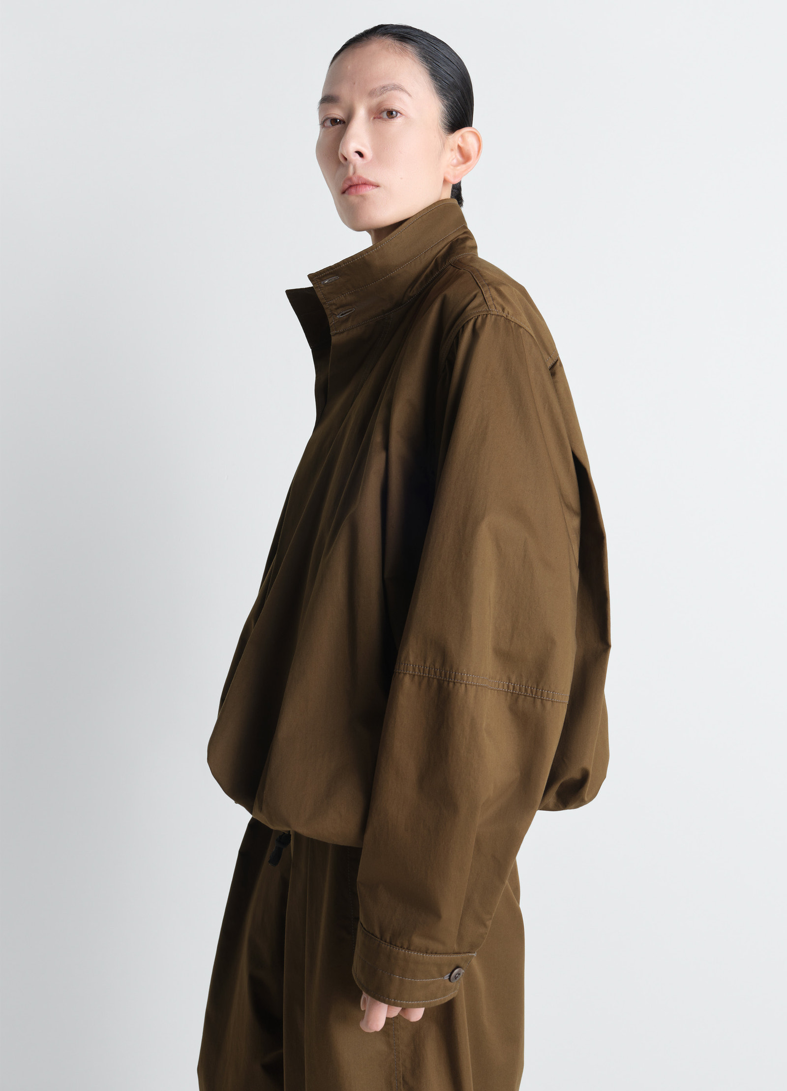 Soft pleated blouson in cotton satin, model shot, side view drop shoulder fit