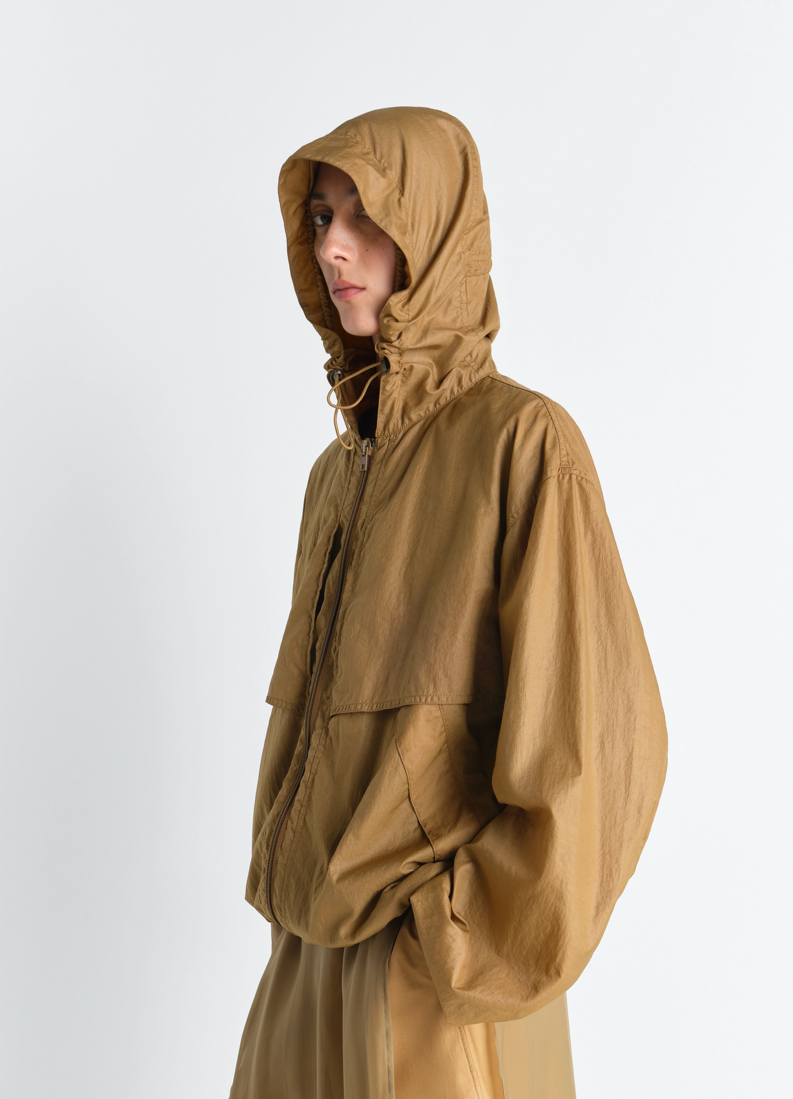 Windbreaker in light nylon in light nylon, model shot, side view hooded, relaxed fit