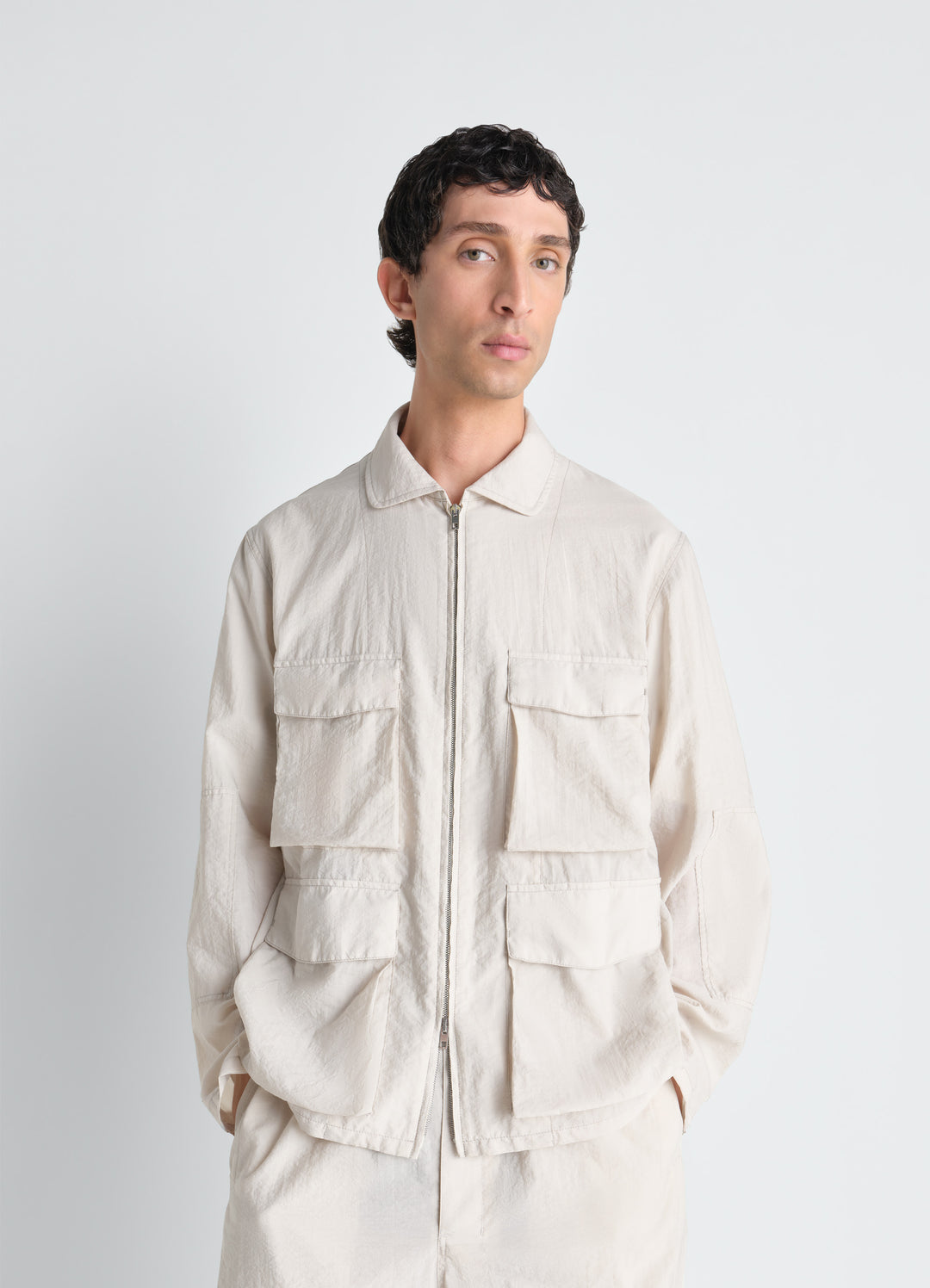 3D Pocket Jacket in Washed Technical Cotton, model shot, Front view, close-up Safari-style, utility pockets
