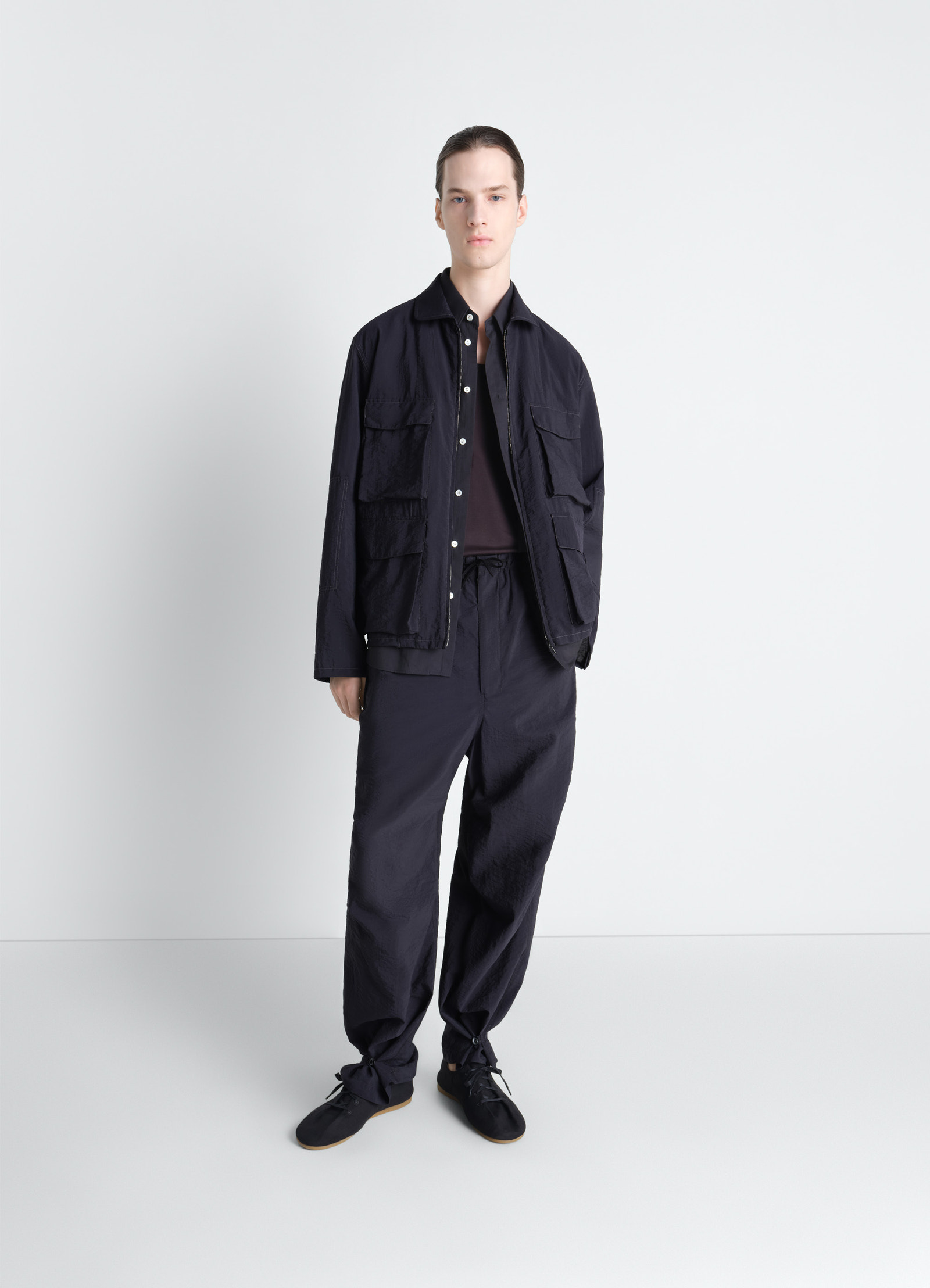 3d pocket jacket in washed technical cotton, model shot, full body view relaxed fit