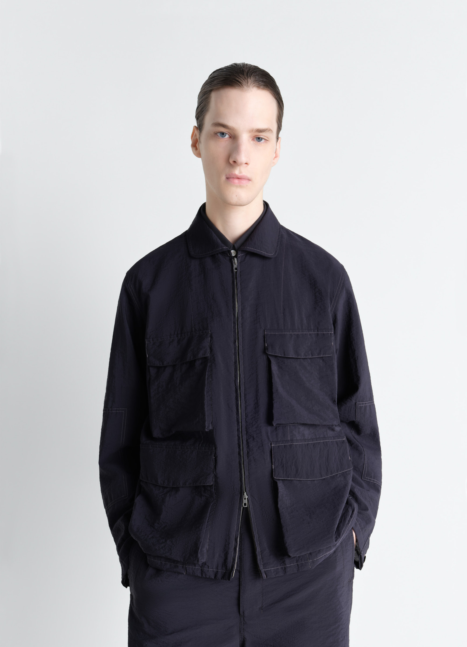 3d pocket jacket in washed technical cotton, model shot, front view safari-style pockets