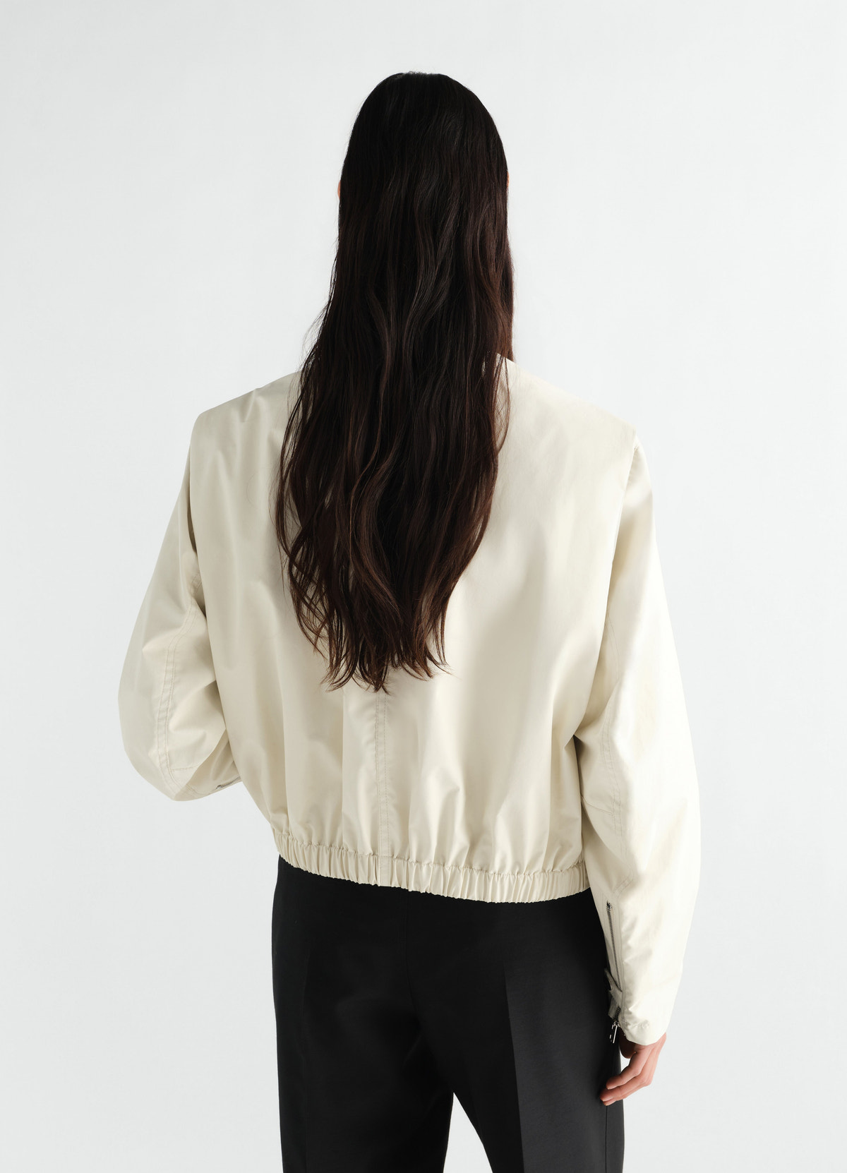 Zipped waterproof cotton blouson jacket in beige lemaire worn by a model back view