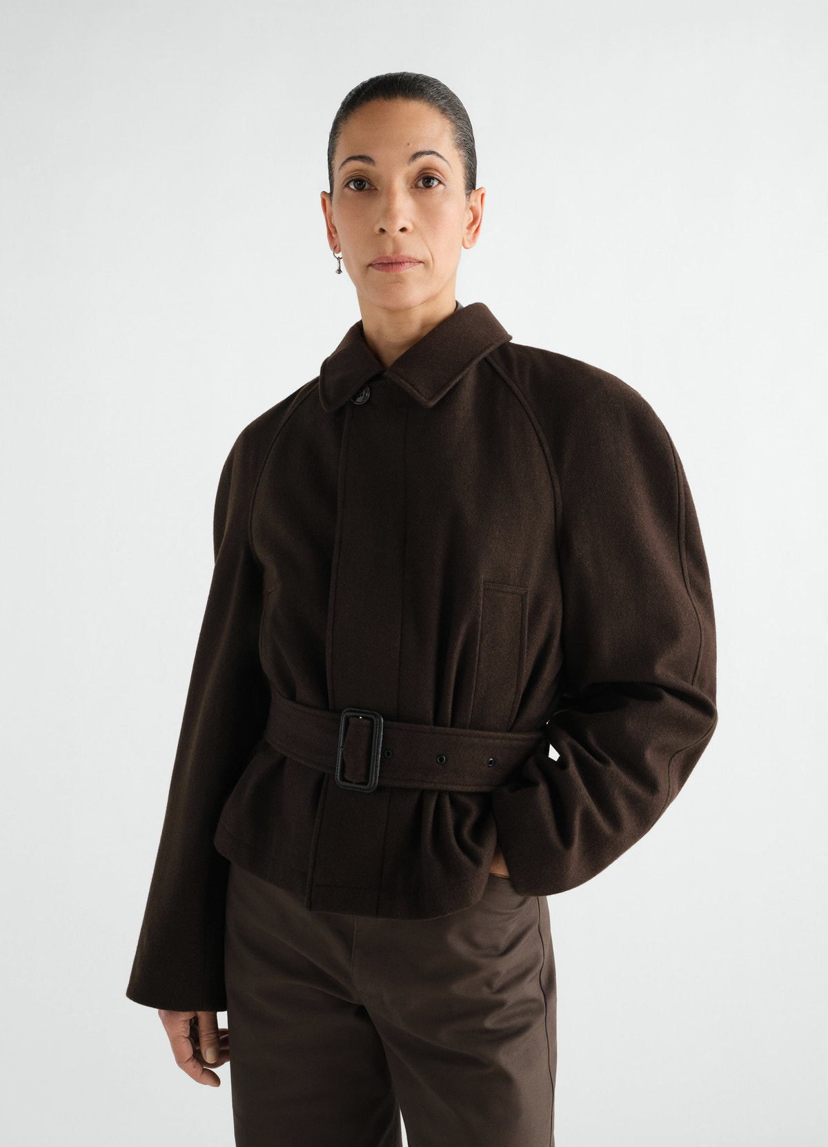 Short brown wool and cotton twill belted coat worn by model front view lemaire