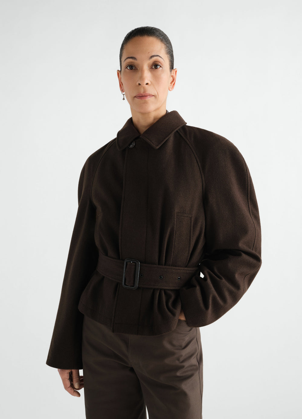 Short brown wool and cotton twill belted coat worn by model front view LEMAIRE