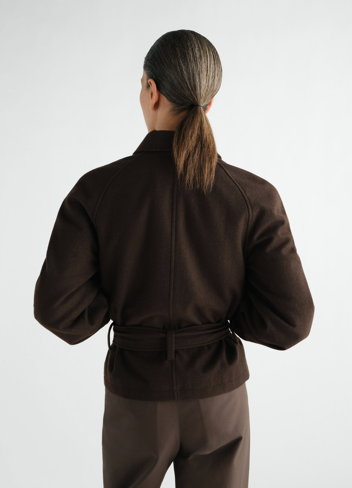 Short brown wool and cotton twill belted coat by lemaire worn by model back view