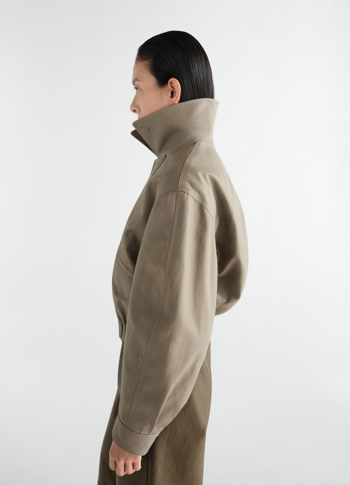 Short blouson in heavy cotton twill beige worn by a model side view lemaire