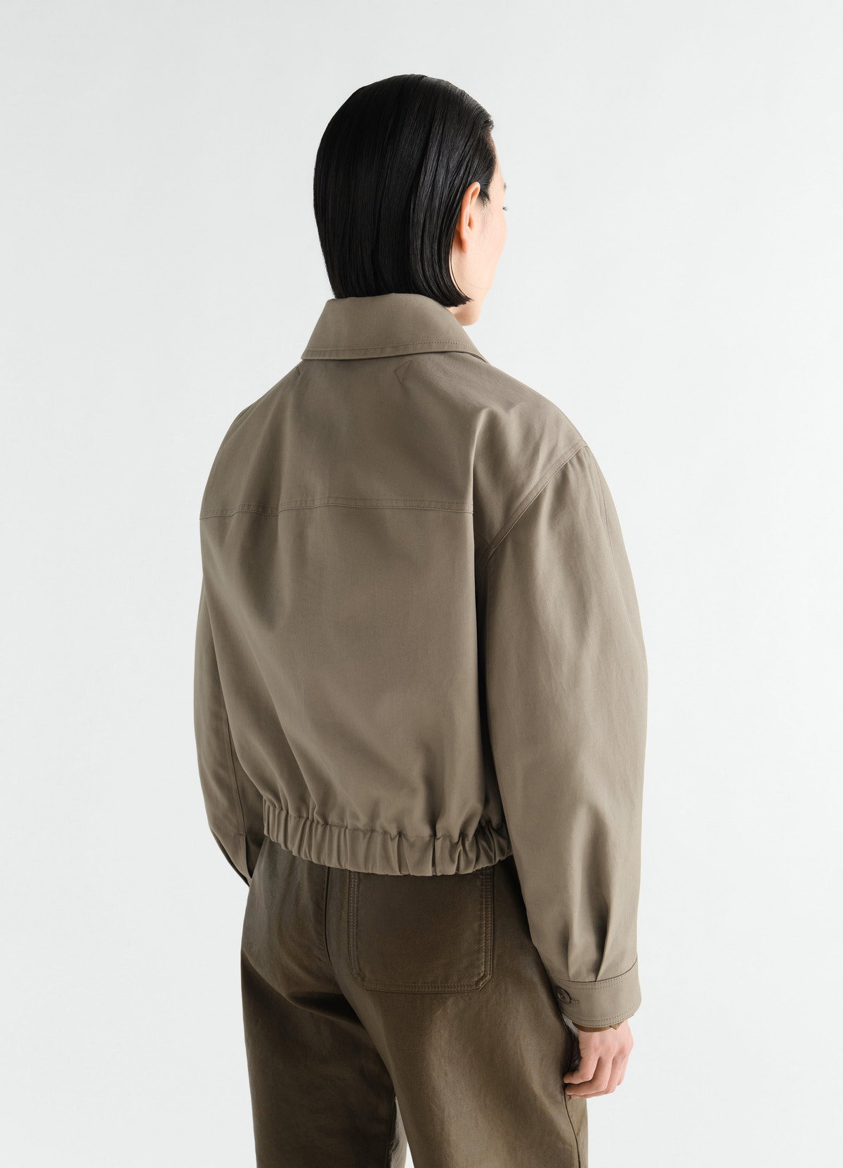 Short brown cotton twill blouson with elastic waist worn by model back view lemaire