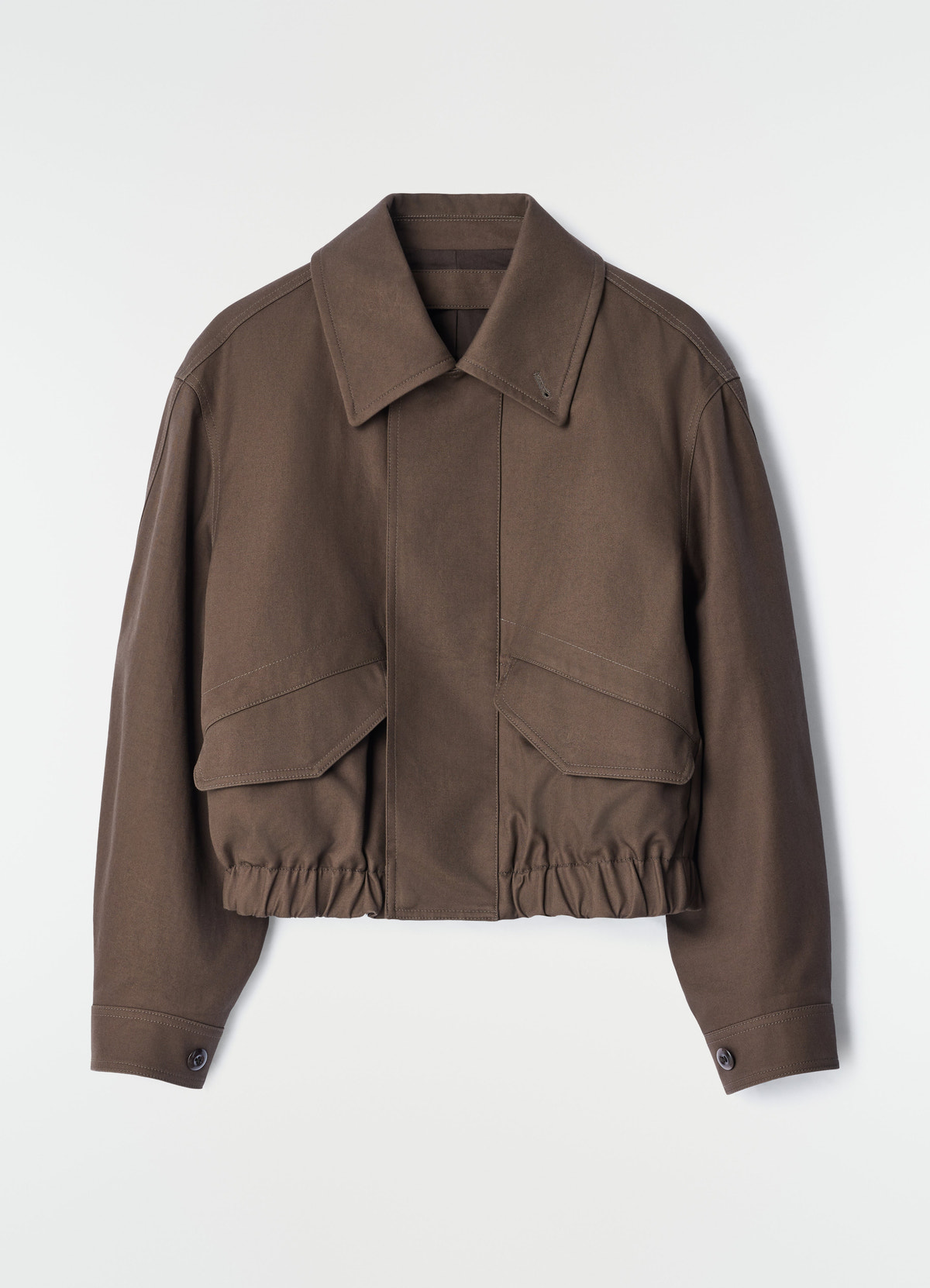 Short brown heavy cotton twill blouson with pockets and elastic hem by lemaire on plain white background