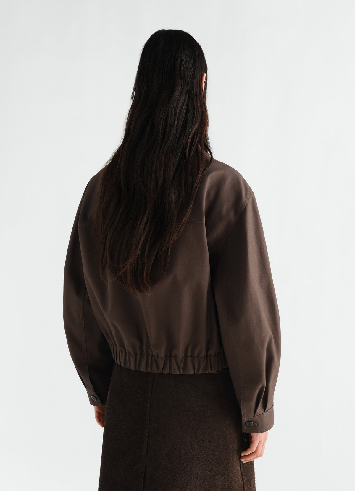 Short brown cotton twill blouson with gathered hem lemaire worn by model back view