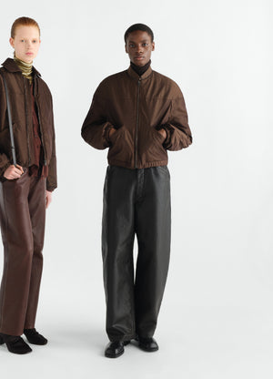 Quilted brown water-repellent canvas blouson worn by model front view lemaire