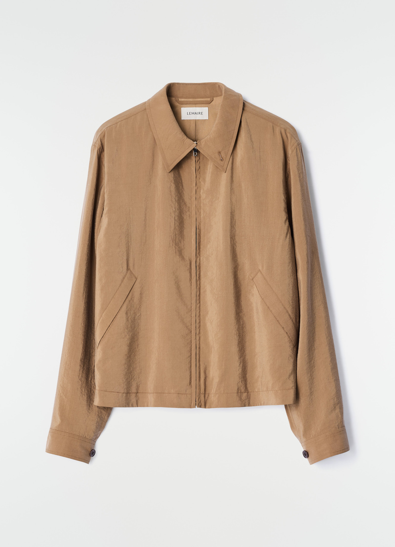 Light brown dry silk zipped blouson jacket by lemaire flat lay front view on white background