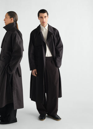 Light black water-repellent cotton gabardine trench coat by lemaire worn by front and side models