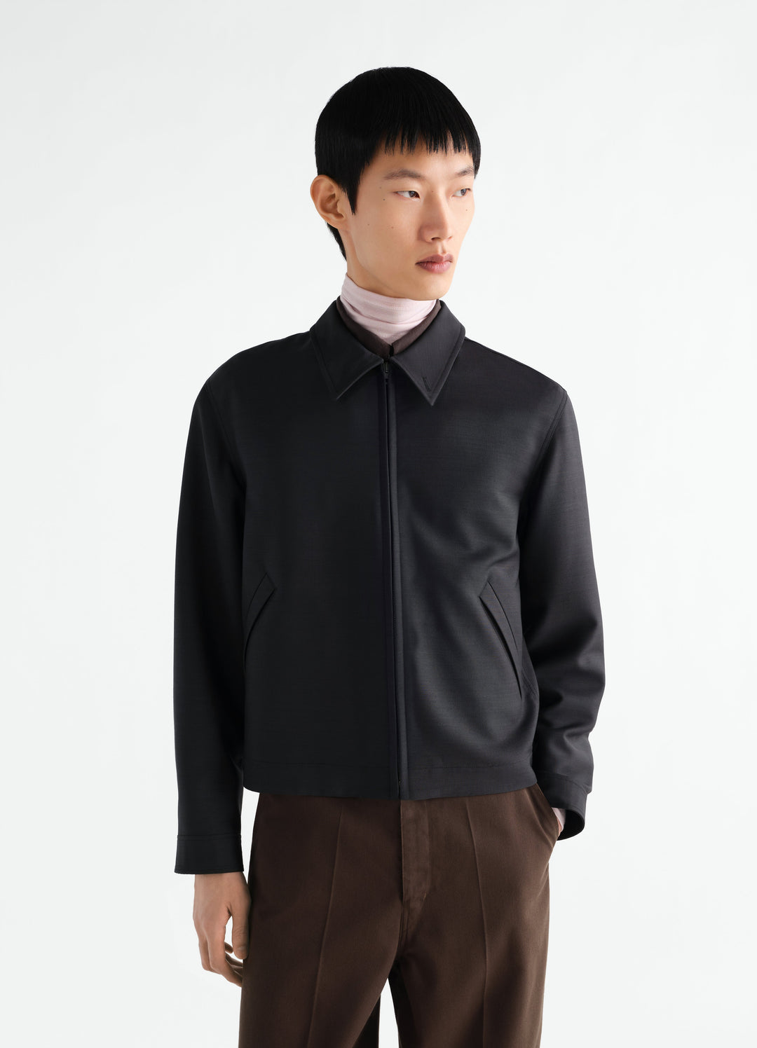 Zipped black double-face wool and viscose blouson worn by model front view LEMAIRE