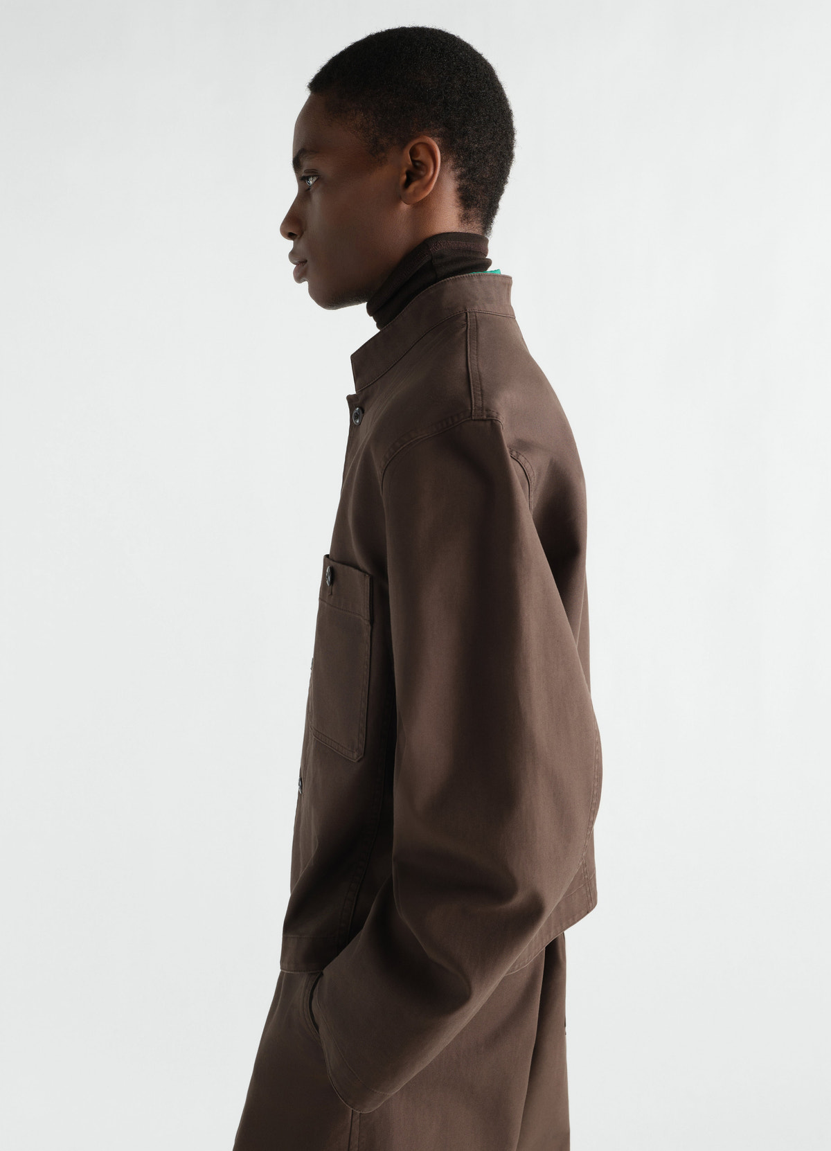 Stand-collar heavy cotton twill brown jacket by lemaire worn by model side view