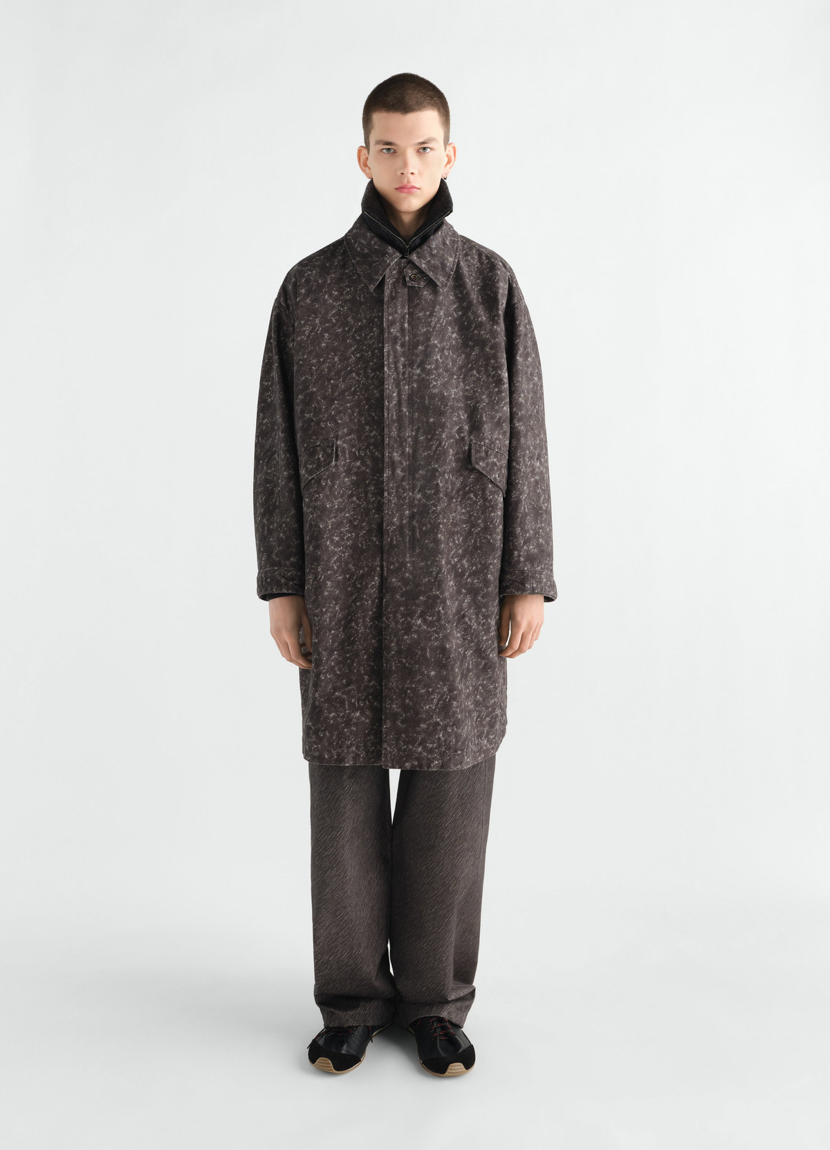 Military parka in dark grey storm printed cotton by lemaire worn by model front view