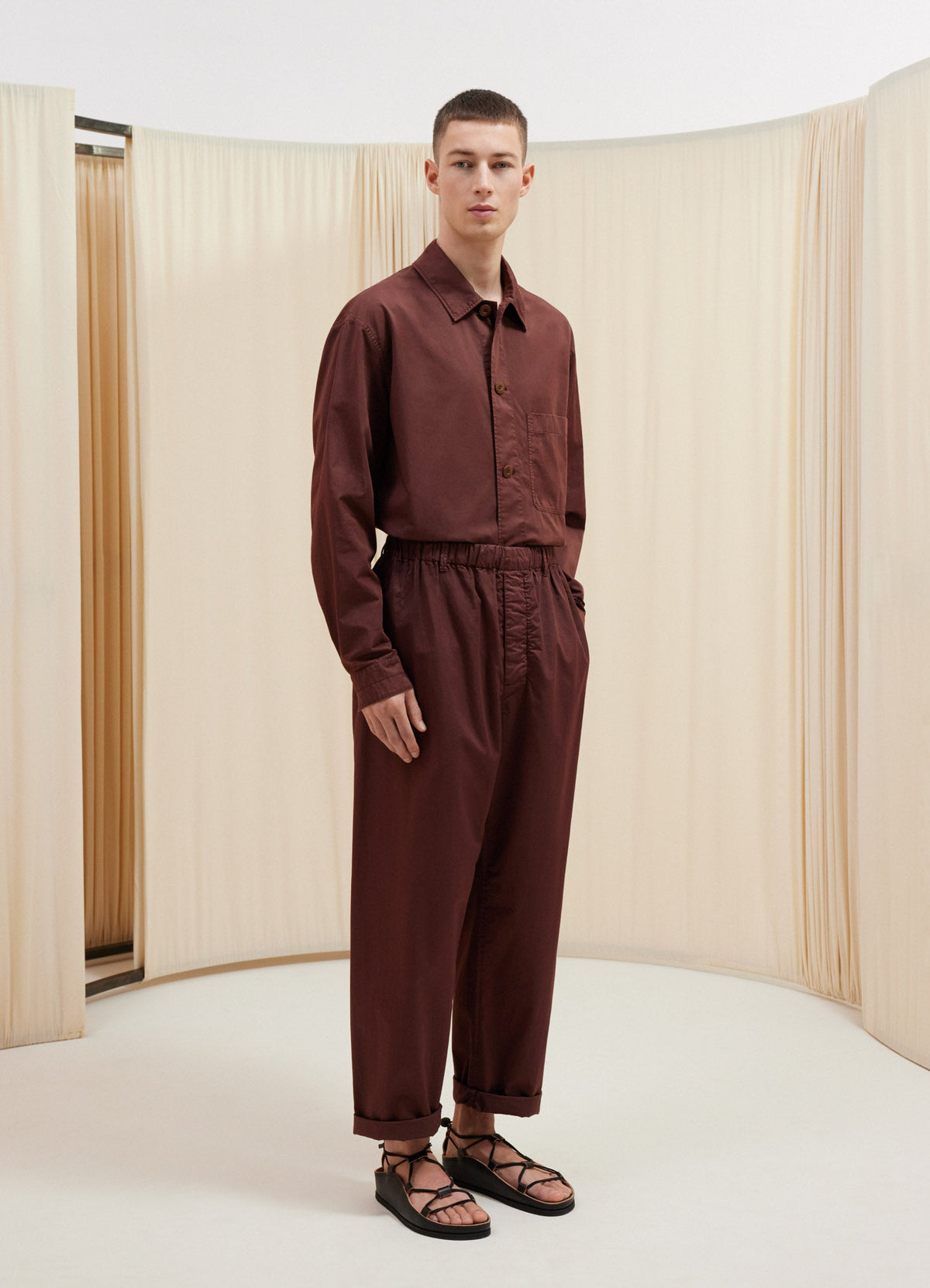 Lemaire Relaxed Pants in Garment Dyed Satin Brown, model shot, front view pyjama-like fit