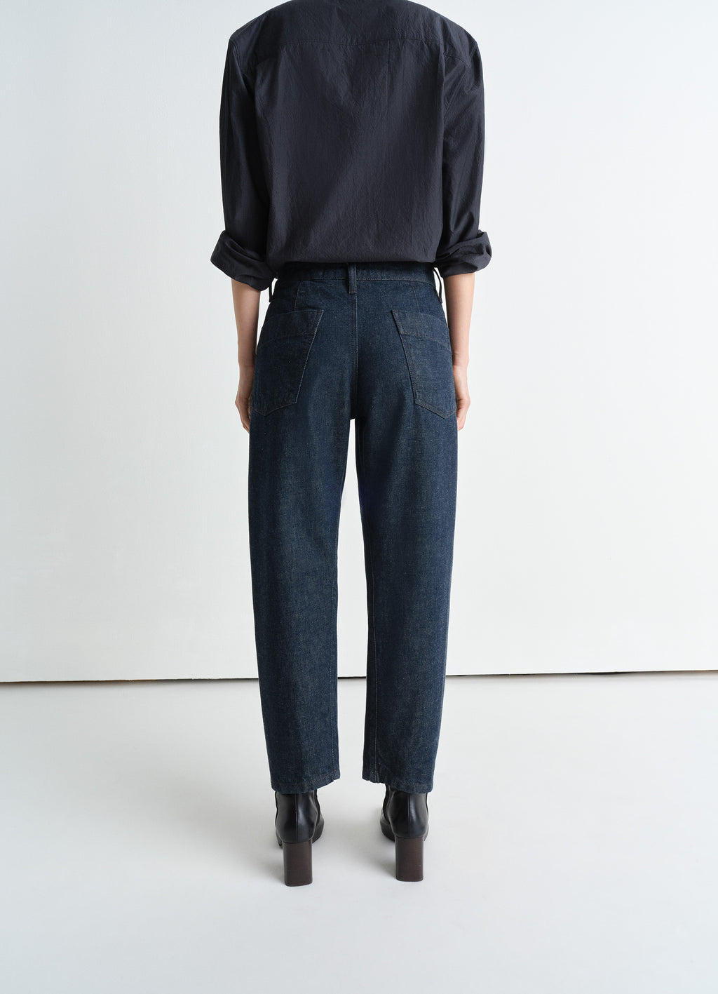 Lemaire Twisted Pants in Deep Indigo Heavy Denim, model shot, back view straight cut, two back pockets
