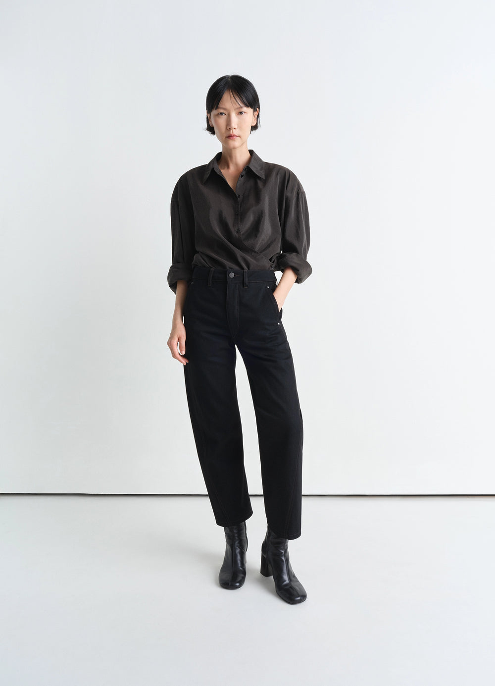 Lemaire Twisted Pants in Deep Black Heavy Denim, model shot, Front view Straight cut with twist seams