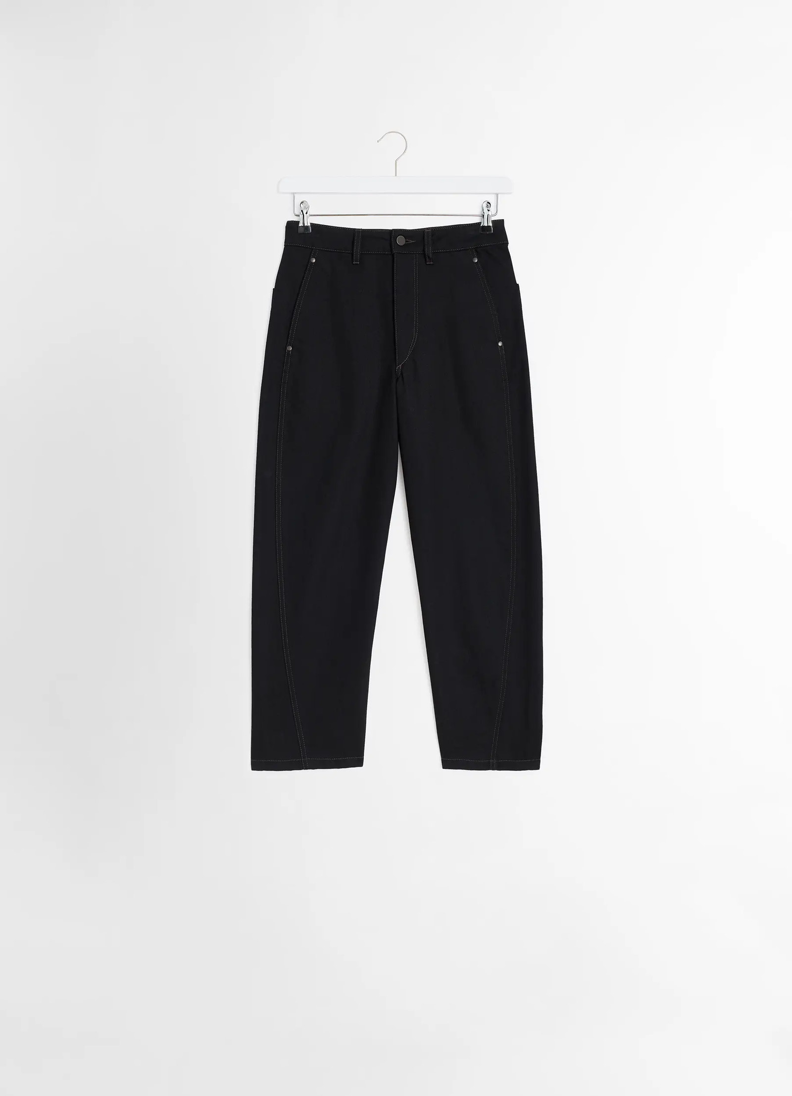 Lemaire twisted pants in deep black heavy denim, product shot, hanging view relaxed fit, visible seams