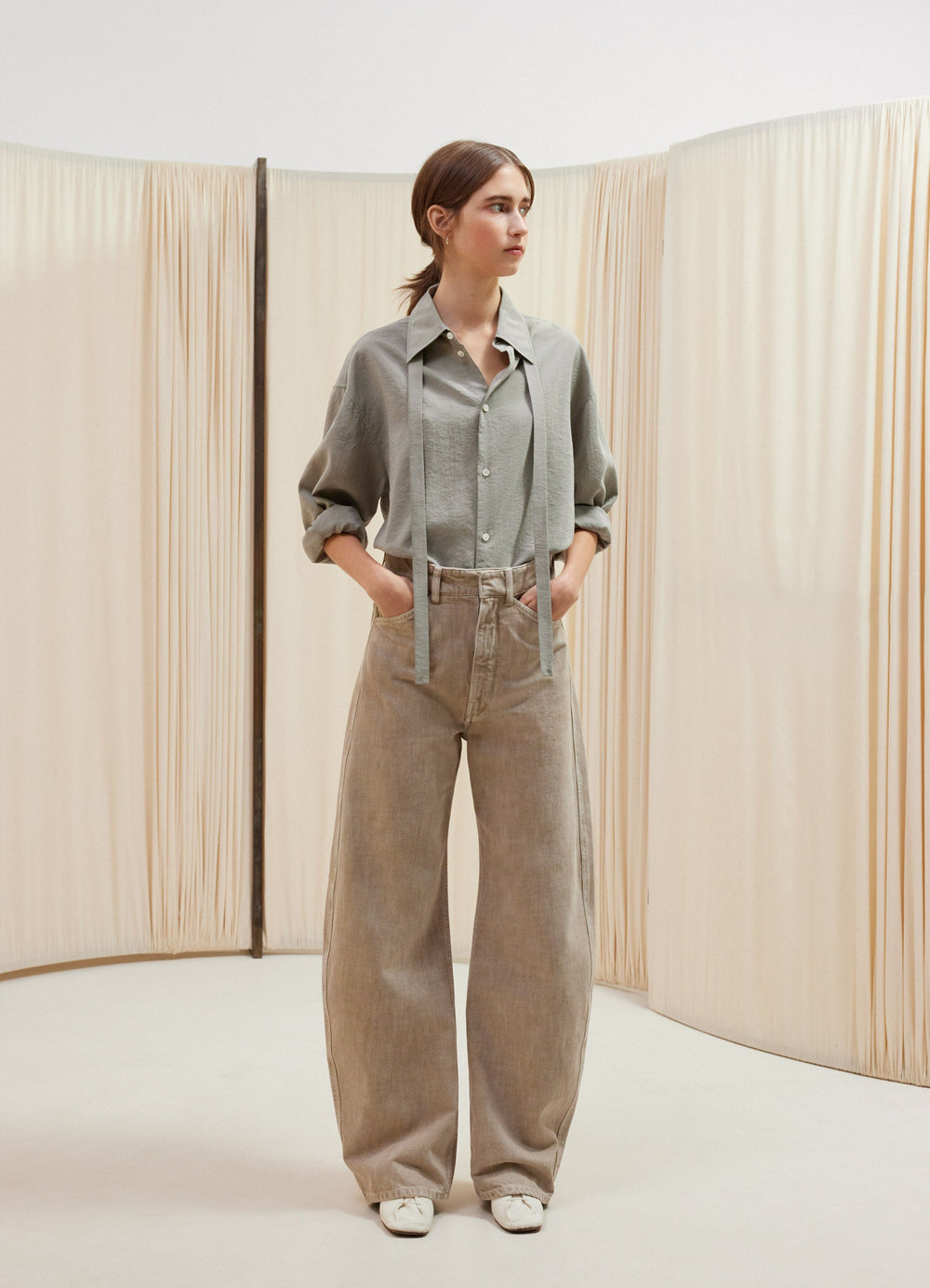 Lemaire High Waisted Curved Pants in Heather Garment Dyed Snow Heavy Den, model shot, front view wide leg, worn by model