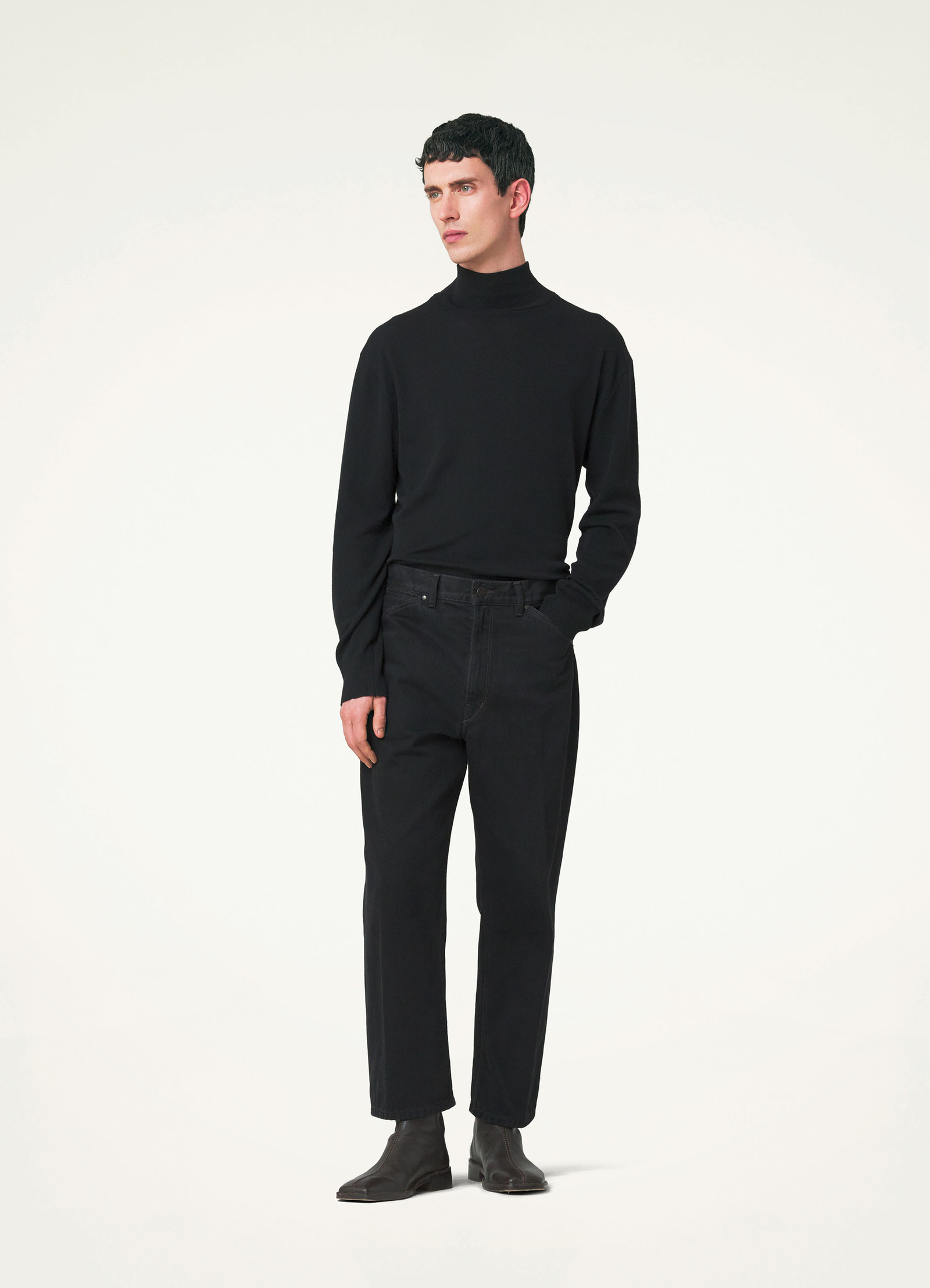Lemaire curved 5 pocket pants in deep black heavy denim, model shot, front view straight fit curved seams