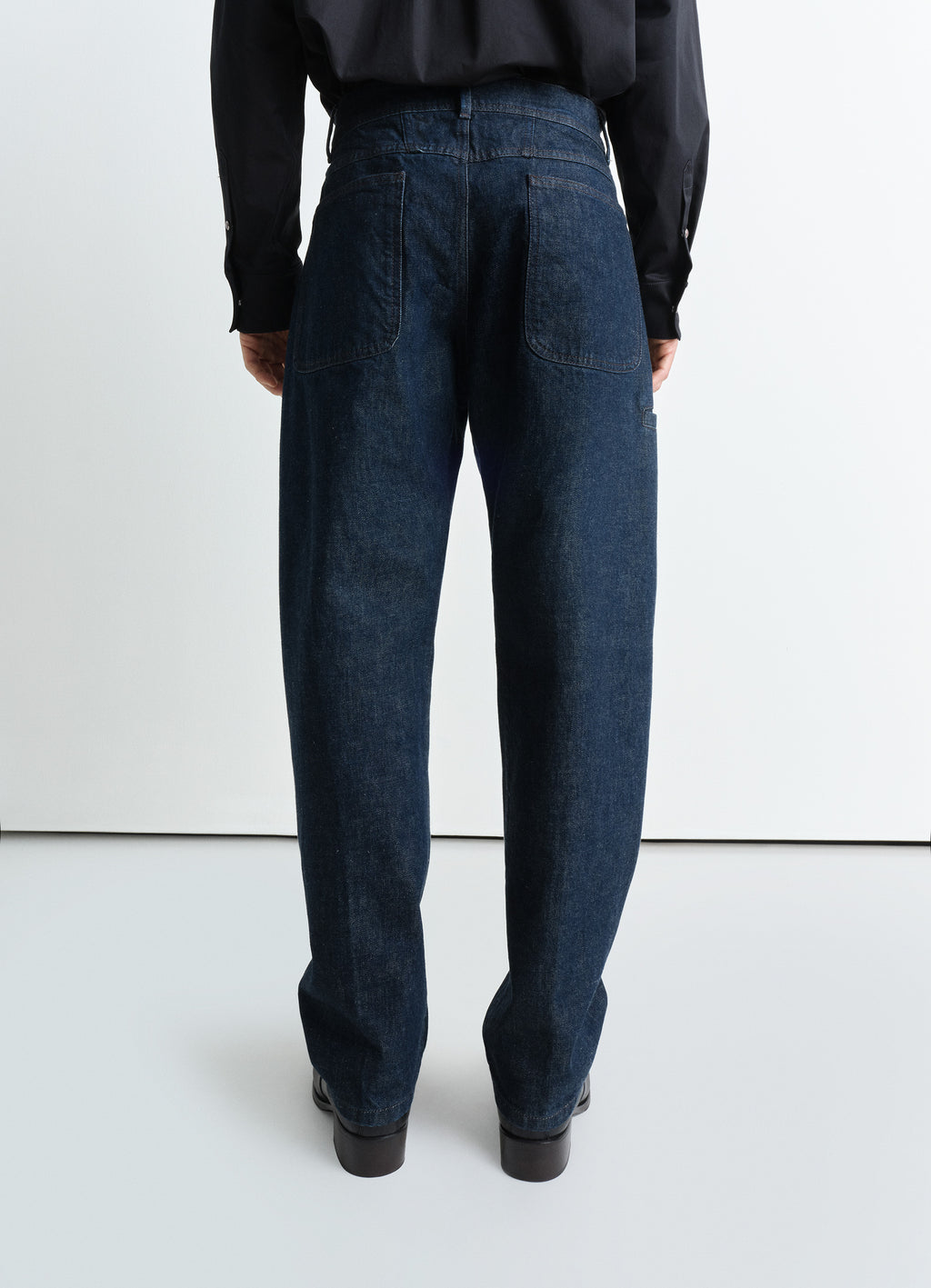 Twisted Workwear Pants in Deep Indigo Heavy Denim, model shot, back view straight leg stitching