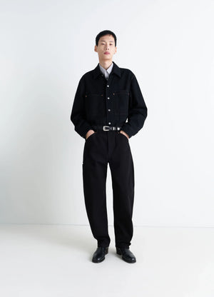 Lemaire Twisted Workwear Pants in Deep Black Thick Denim, model shot, Front view Twisted seams rounded leg