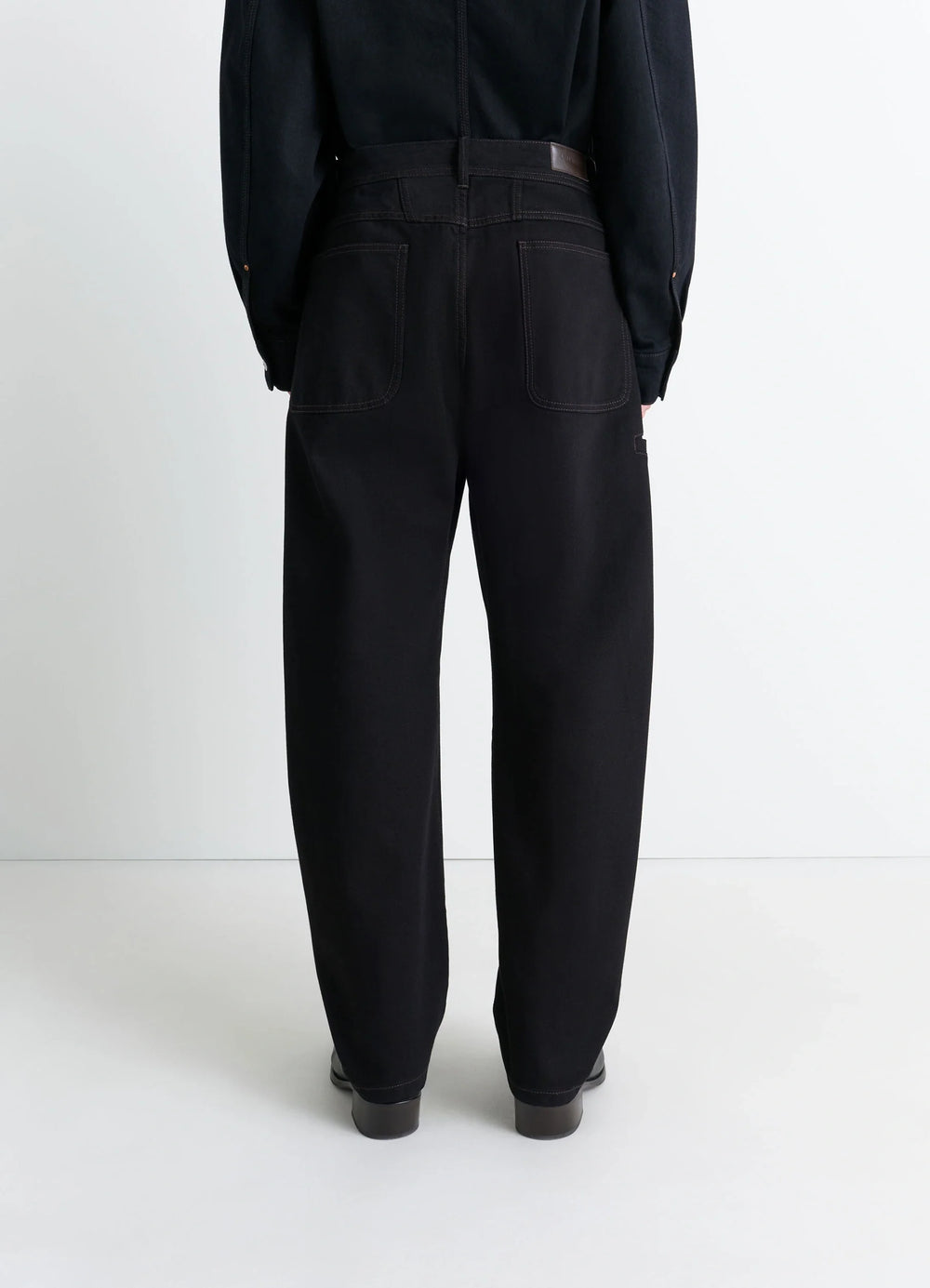 Lemaire Twisted Workwear Pants in Deep Black Thick Denim, model shot, back view utilitarian pockets