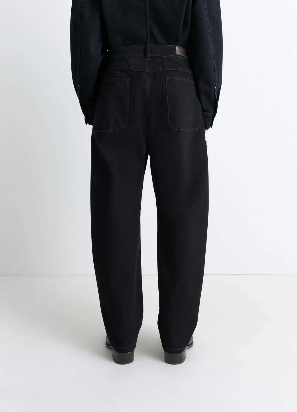 Lemaire Twisted Workwear Pants in Deep Black Thick Denim, model shot, back view utilitarian pockets