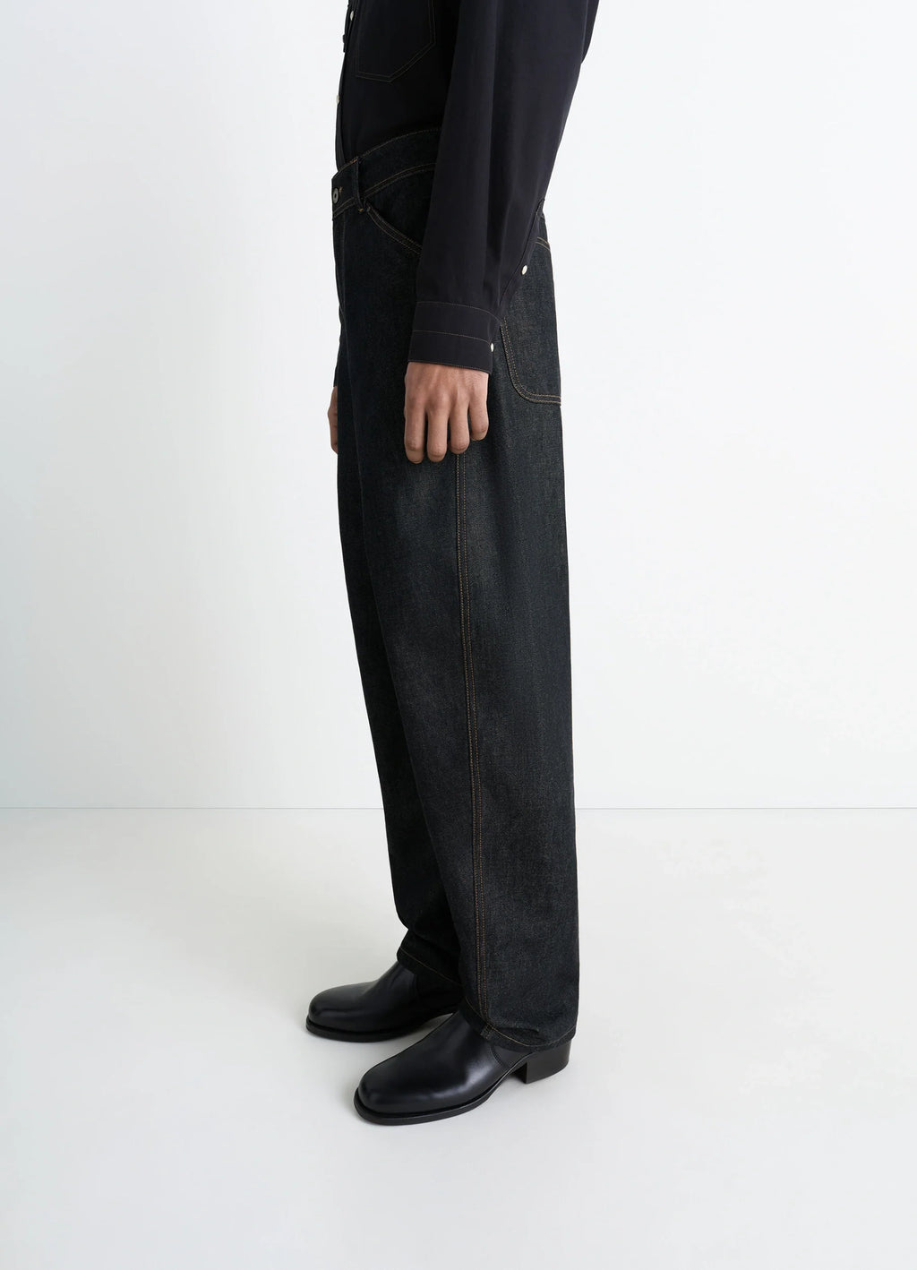 Lemaire Twisted Workwear Pants in Slate Denim, model shot, side view wide leg, utilitarian