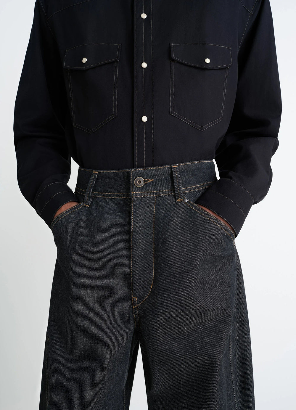 Lemaire Twisted Workwear Pants in Slate Denim, model shot, waist detail shot high-waisted, contrast stitching