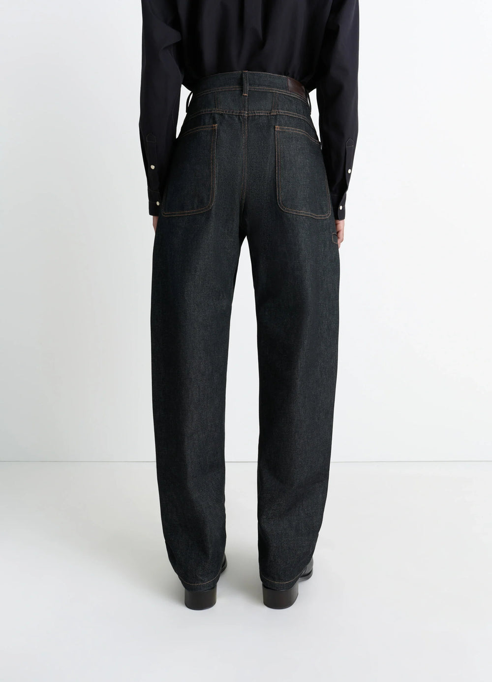 Lemaire Twisted Workwear Pants in Slate Denim, model shot, back view high-waisted, back pockets
