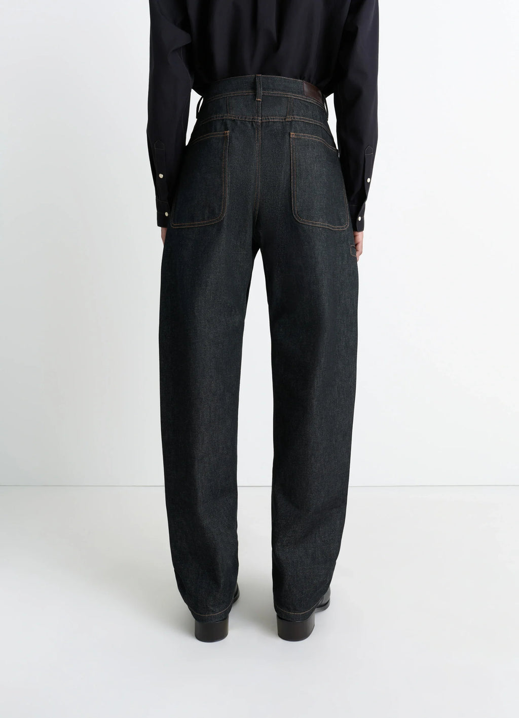 Lemaire Twisted Workwear Pants in Slate Denim, model shot, back view high-waisted, back pockets