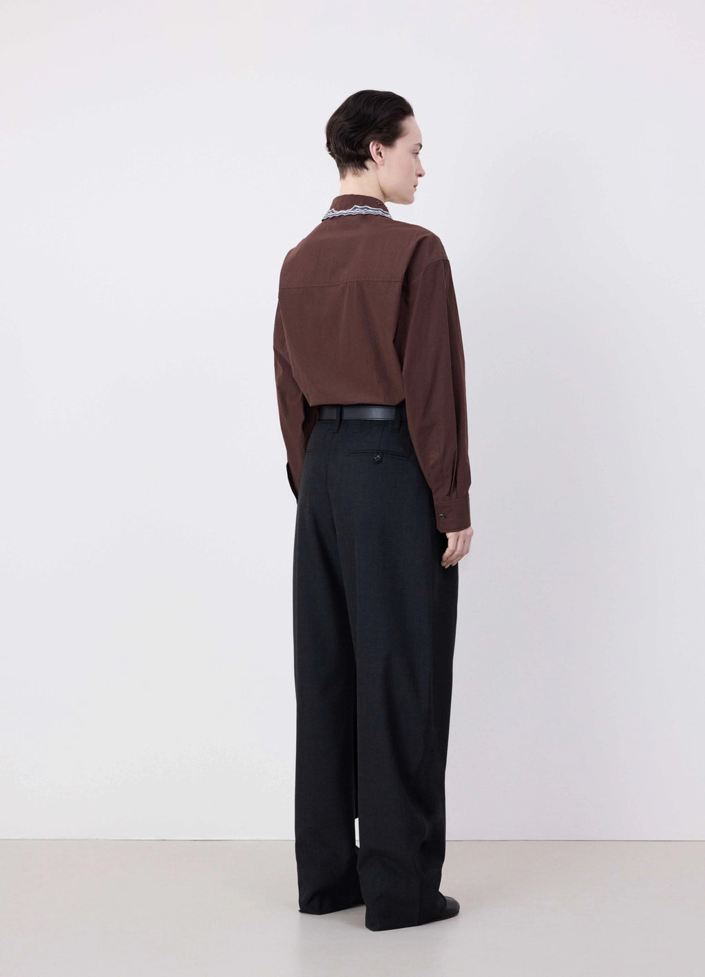 Lemaire Curved Volume Tailored Pant in Mélange Poly-Wool Twill, model shot, back view high-waisted fit