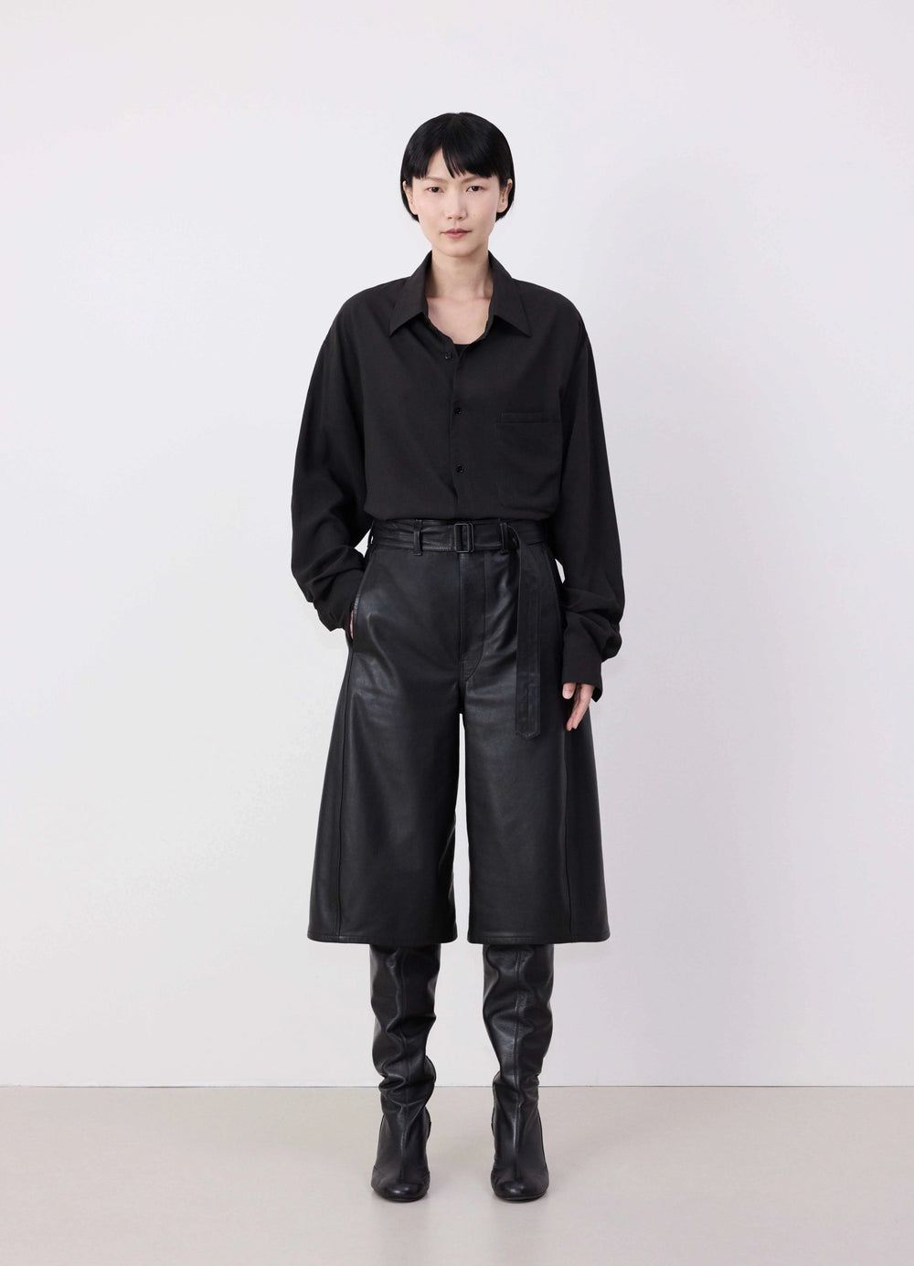 Lemaire Leather Bermuda Shorts in Nappa Cow Leather, model shot, Front view Relaxed fit with belt