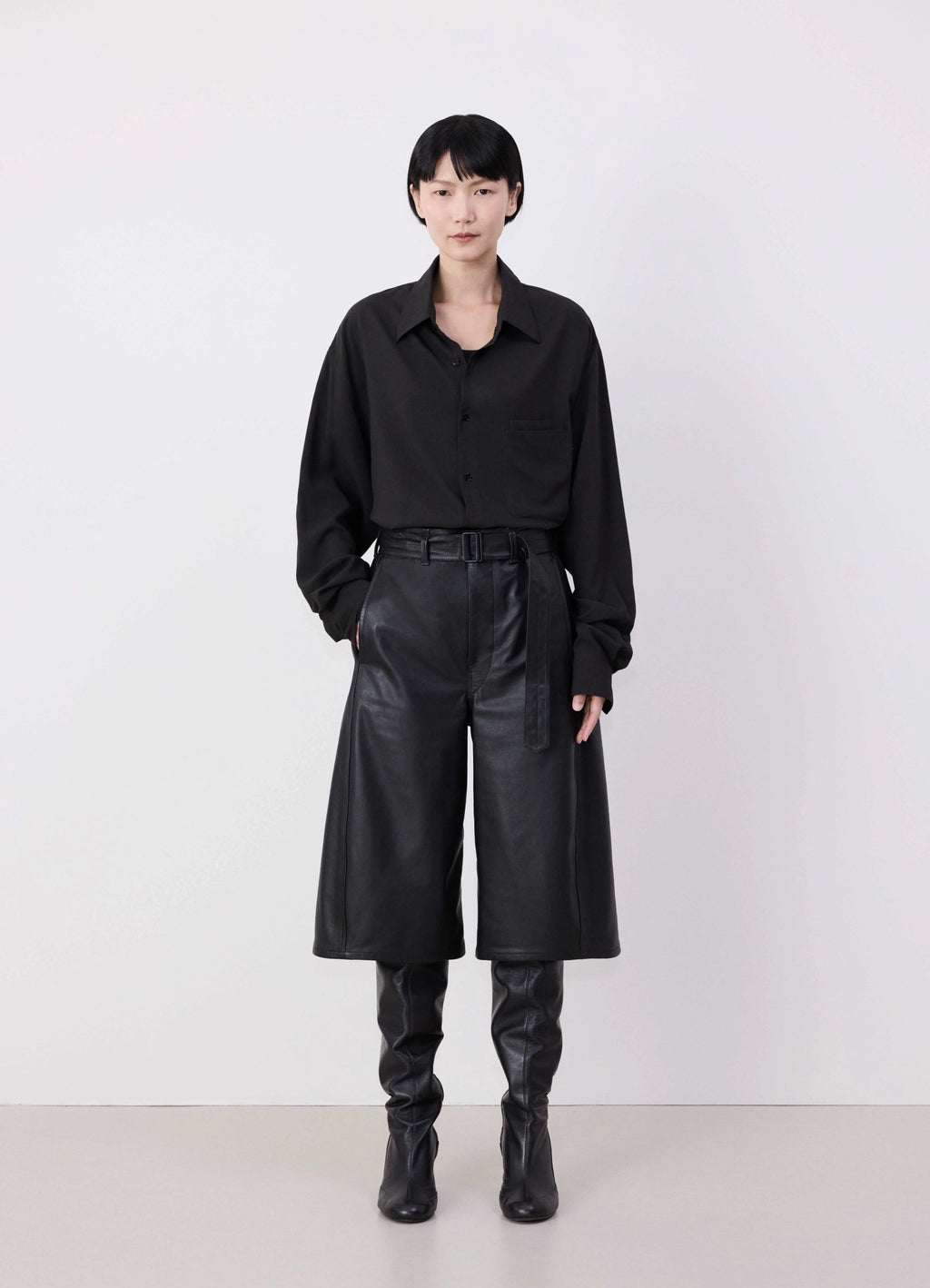 Lemaire Leather Bermuda Shorts in Nappa Cow Leather, model shot, Front view Relaxed fit with belt
