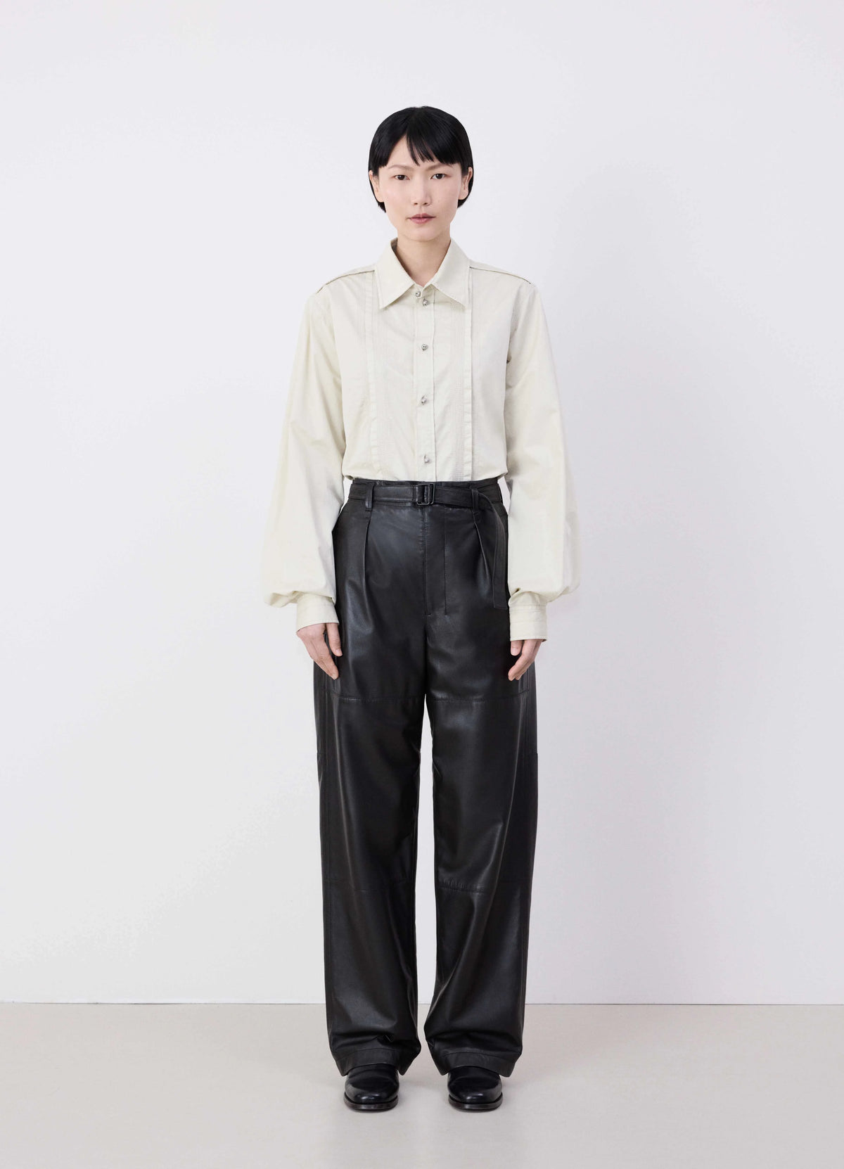Lemaire Drawstring Parachute Pants in Black Ultra-fine Lamb Leather, model shot, Front view Wide leg, relaxed silhouette
