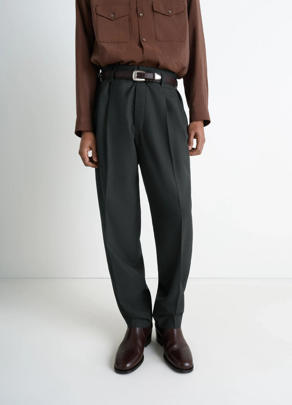 Lemaire Pleated Pants in Tropical Wool-Blend, model shot, side view tailored metal buckle tab