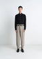 Lemaire Pleated Pants in Tropical wool-blend suiting, model shot, front view metal buckle tabs