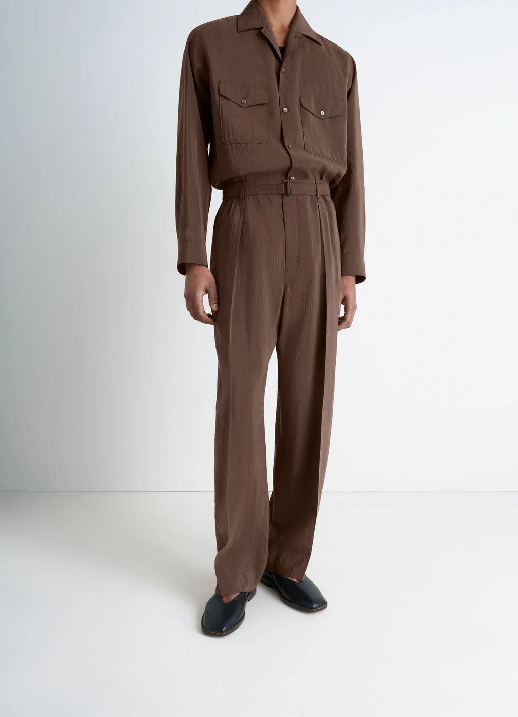Lemaire Belted Relaxed Pants in Brown Dry Silk Blend, model shot, side view wide leg silhouette