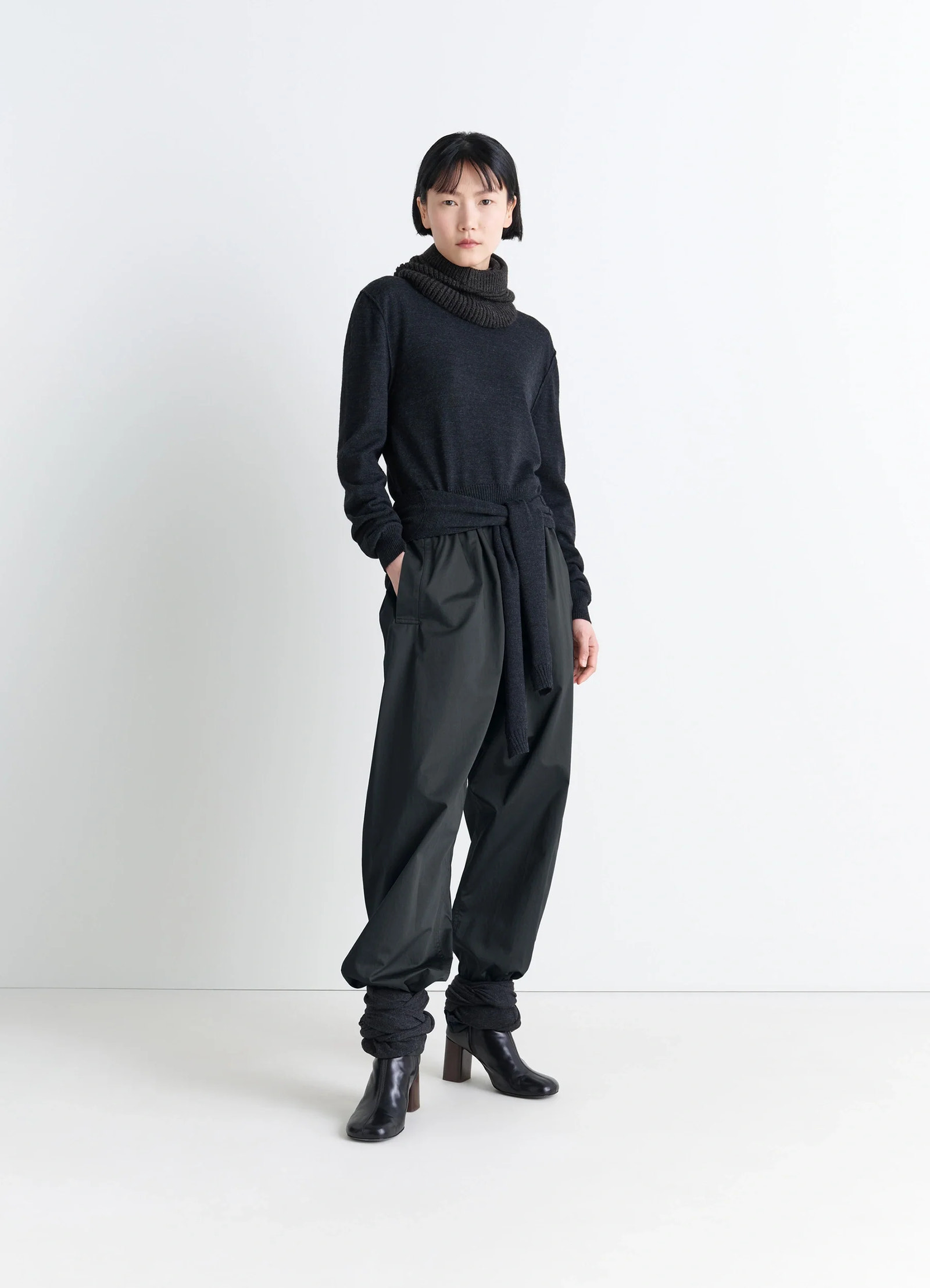 Lemaire pyjama pants in garment dyed satin, model shot, front view cinched ankle design