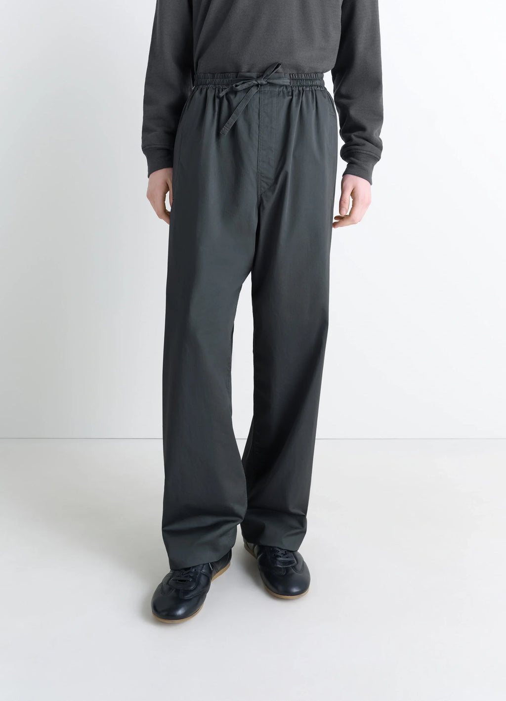 Lemaire Pyjama Pants in Garment Dyed Satin, model shot, three-quarter front view elastic waistband detail
