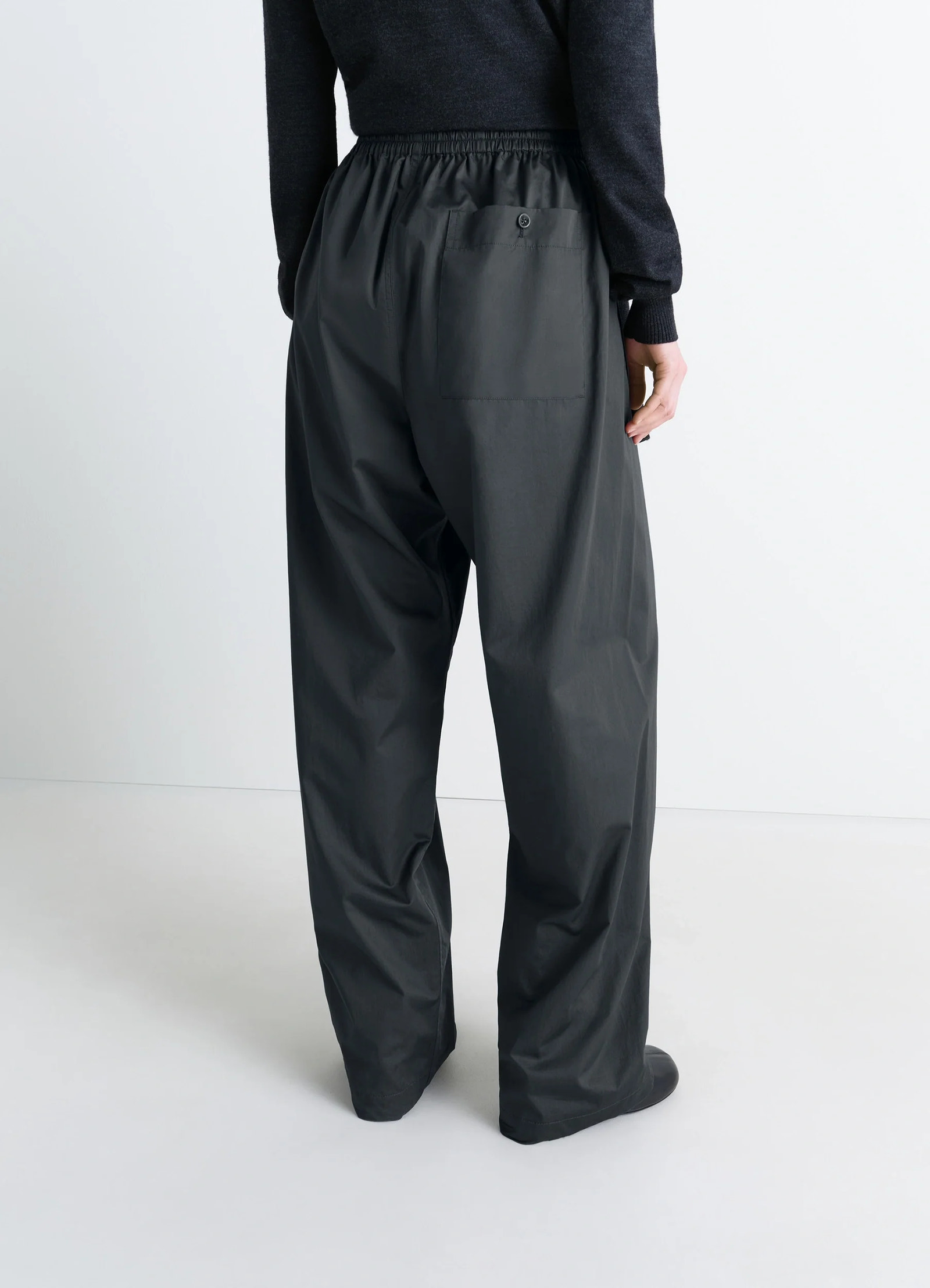 Lemaire pyjama pants in garment dyed satin, model shot, back view elastic waistband, single back pock