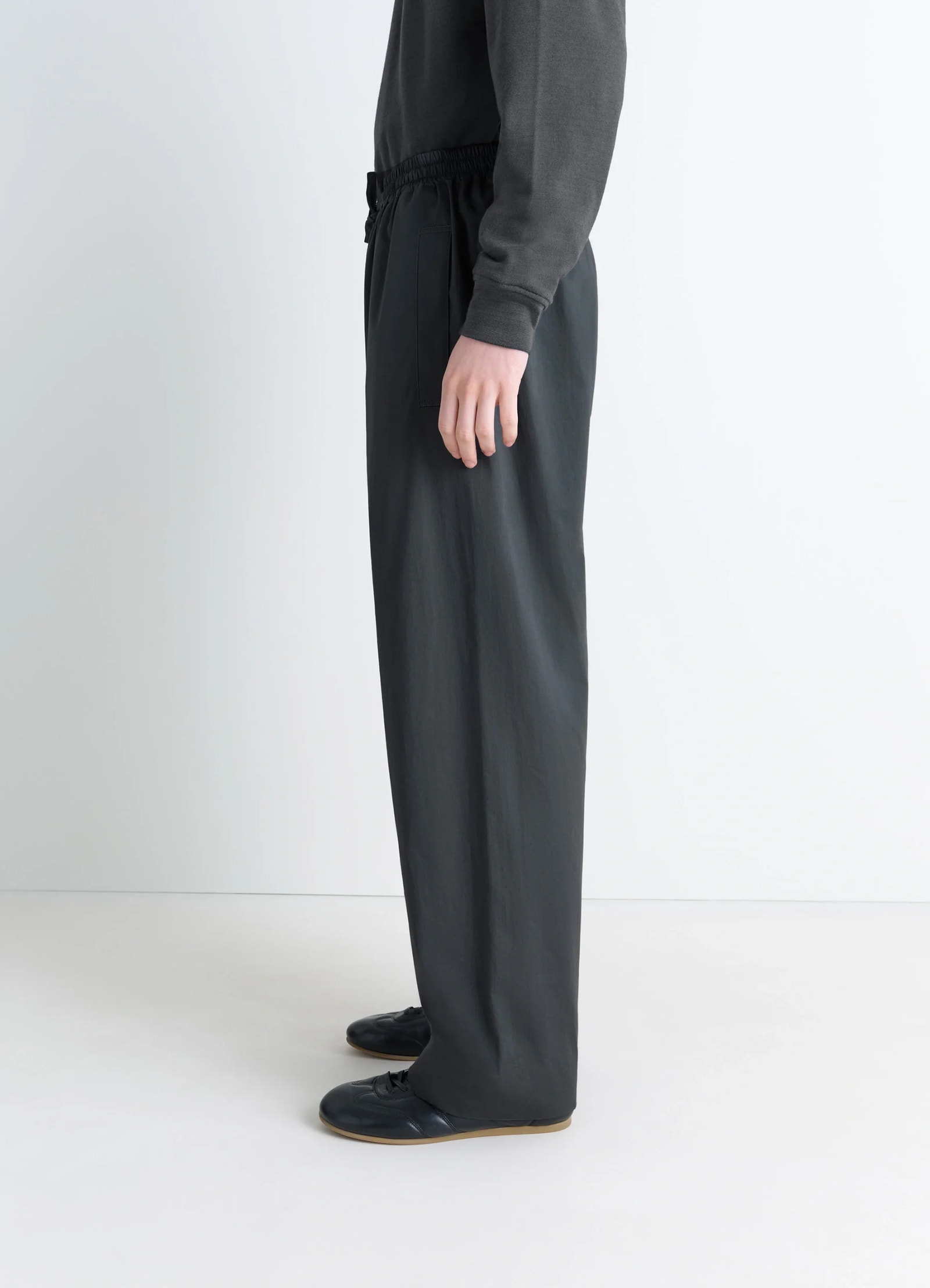 Lemaire pyjama pants in garment dyed satin, model shot, profile view straight leg silhouette